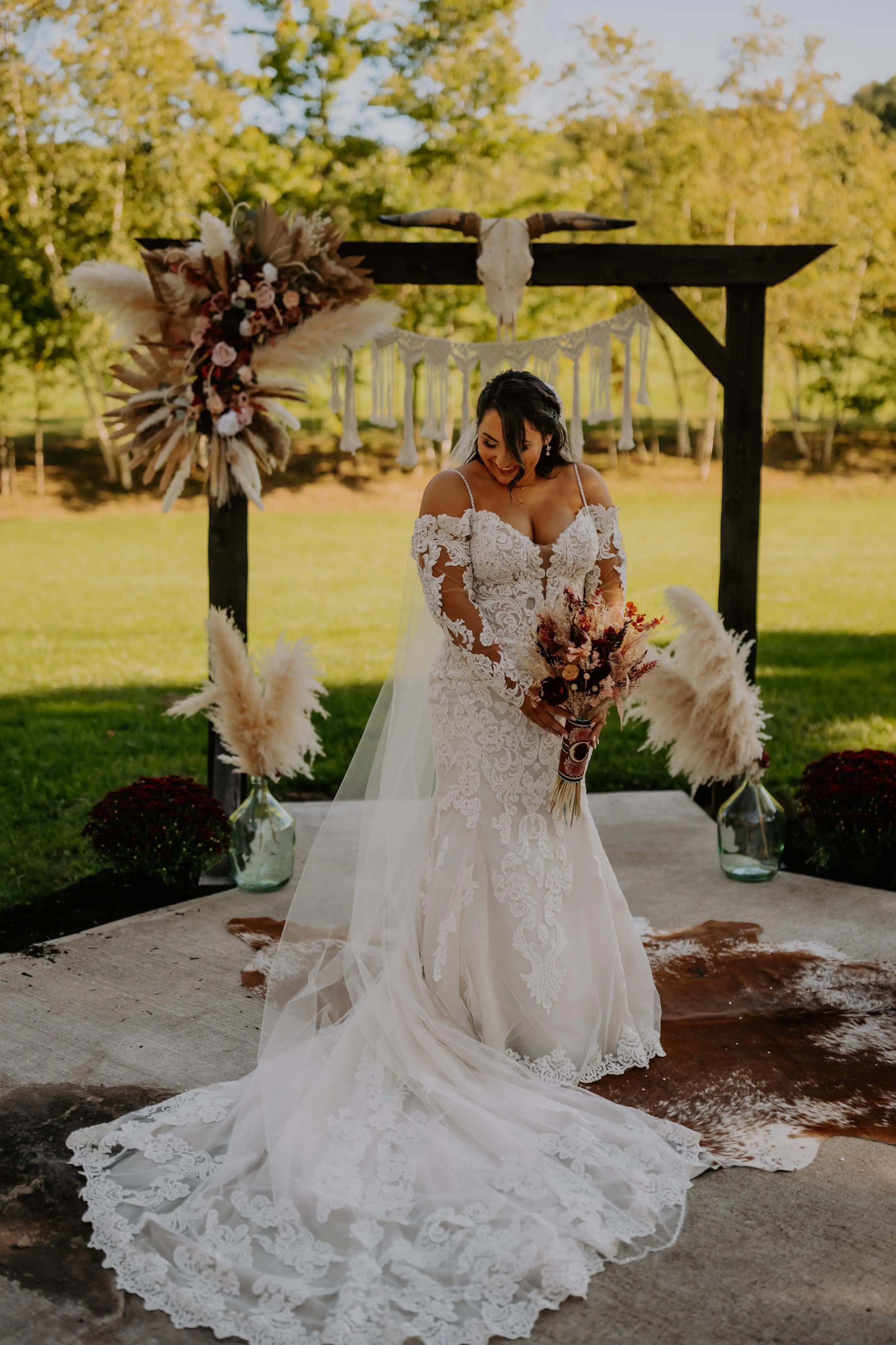 Bride wearing Fiona wedding dress by Maggie Sottero showing off her train