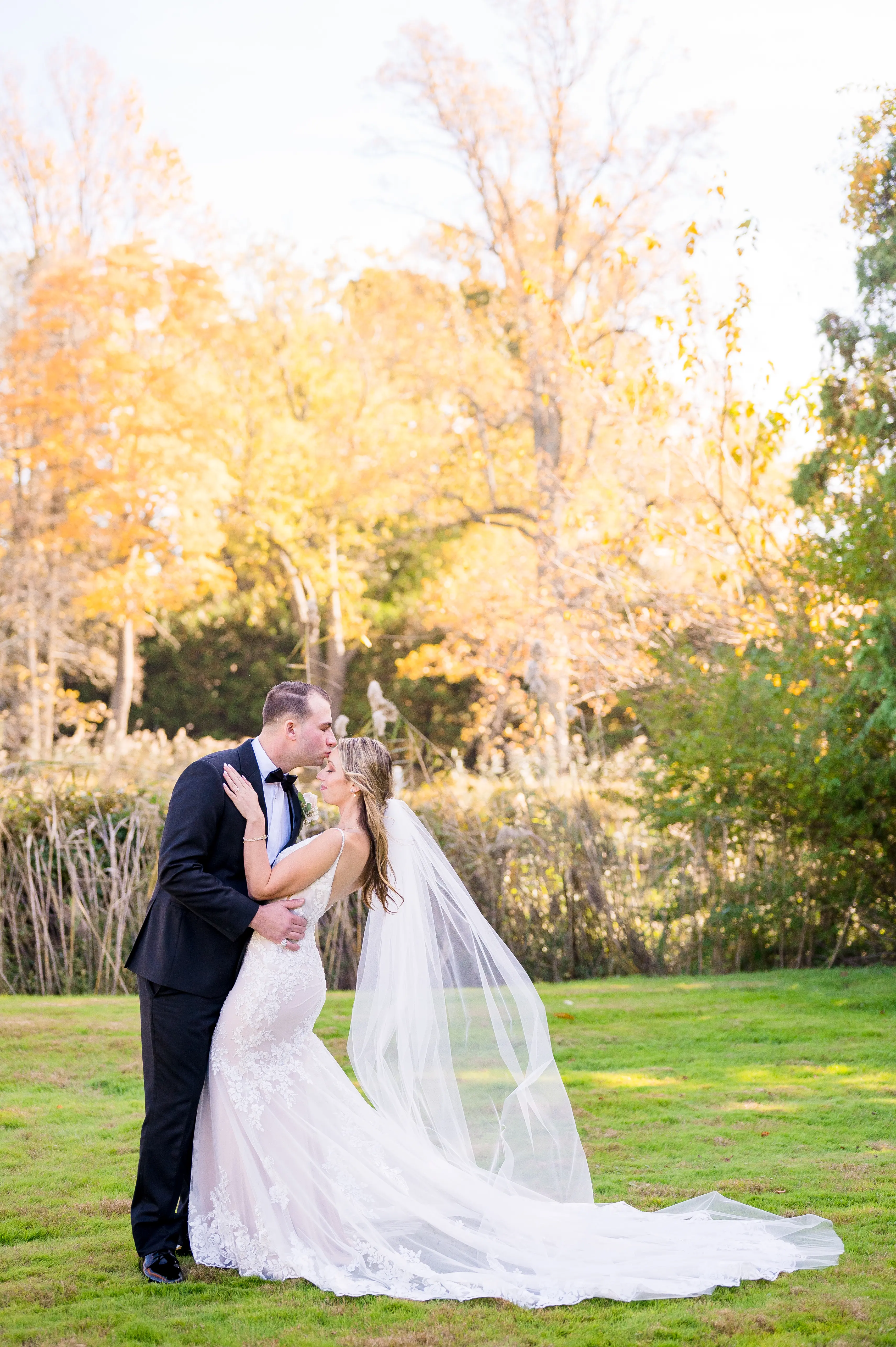 Real bride in sparkly lace fit-and-flare bridal gown with lace motifs over tulle called Fontaine by Maggie Sottero