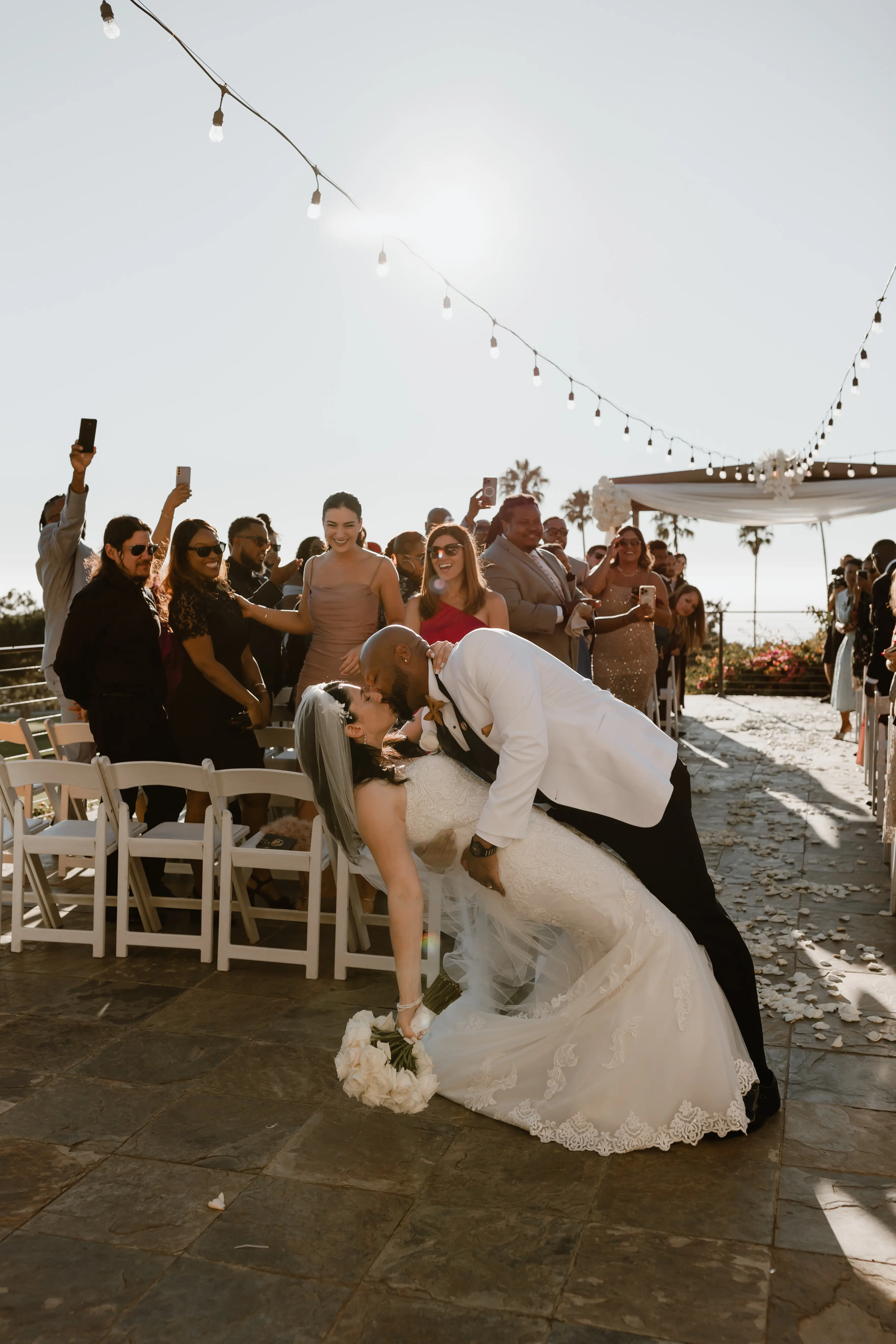 Bride Wearing Lace Wedding Dress Called Fiona By Maggie Sottero At Tropical Venue With Groom In White Suit