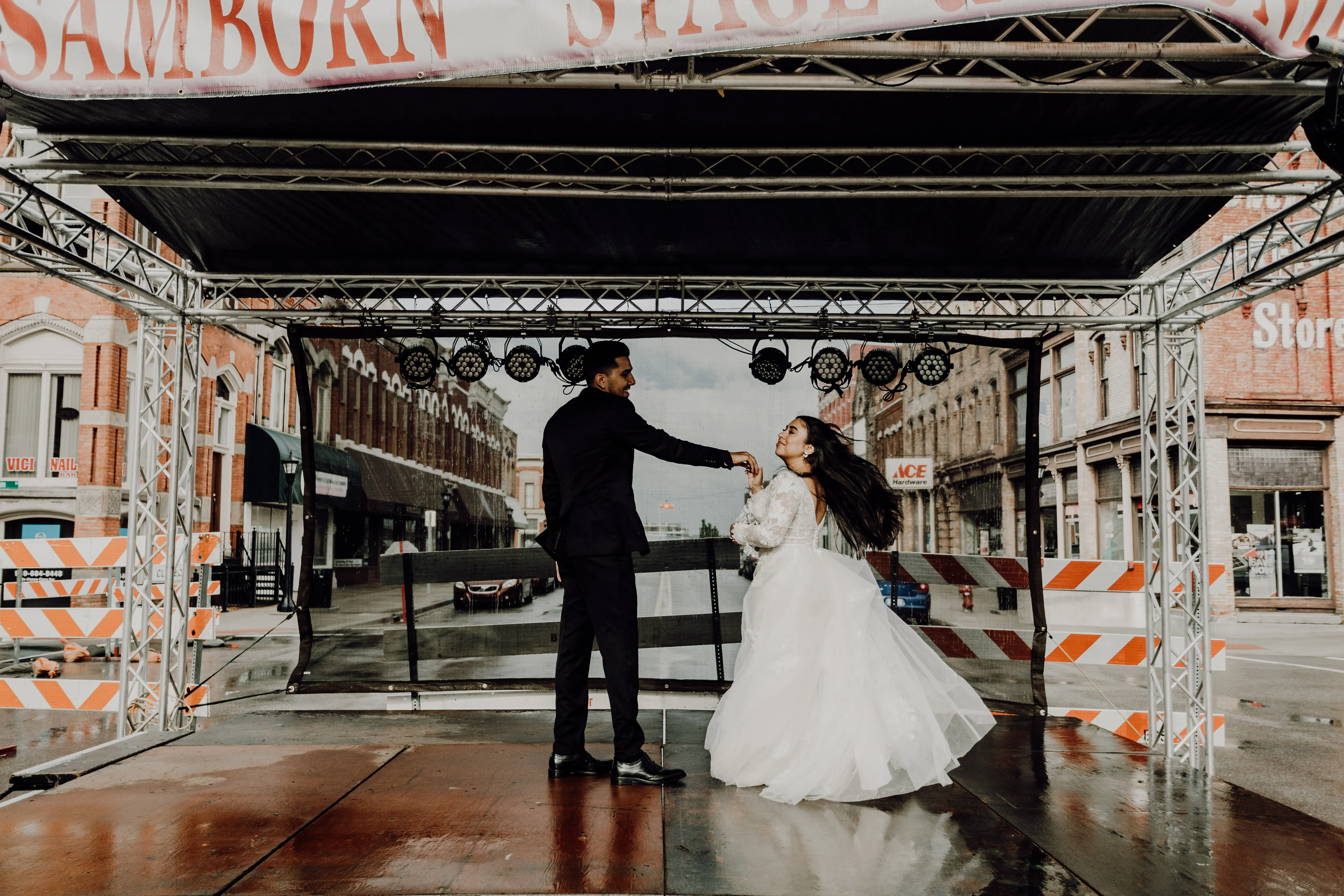 Groom and Bride Wearing Lace Aline Wedding Dress Called Raelynn by Rebecca Ingram