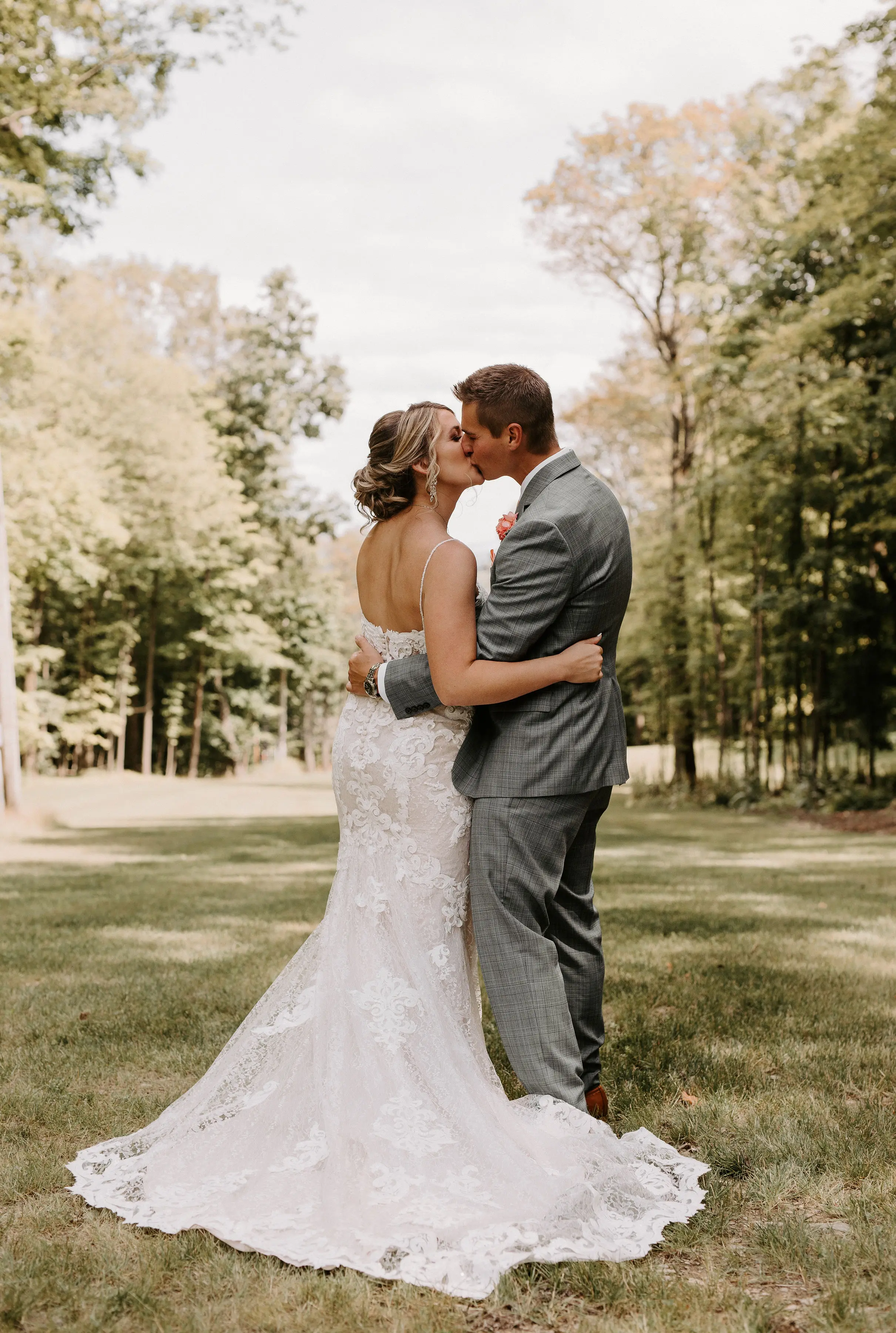 Bride Wearing Lace Sexy Wedding Dress Called Tuscany Lynette By Maggie Sottero With Groom