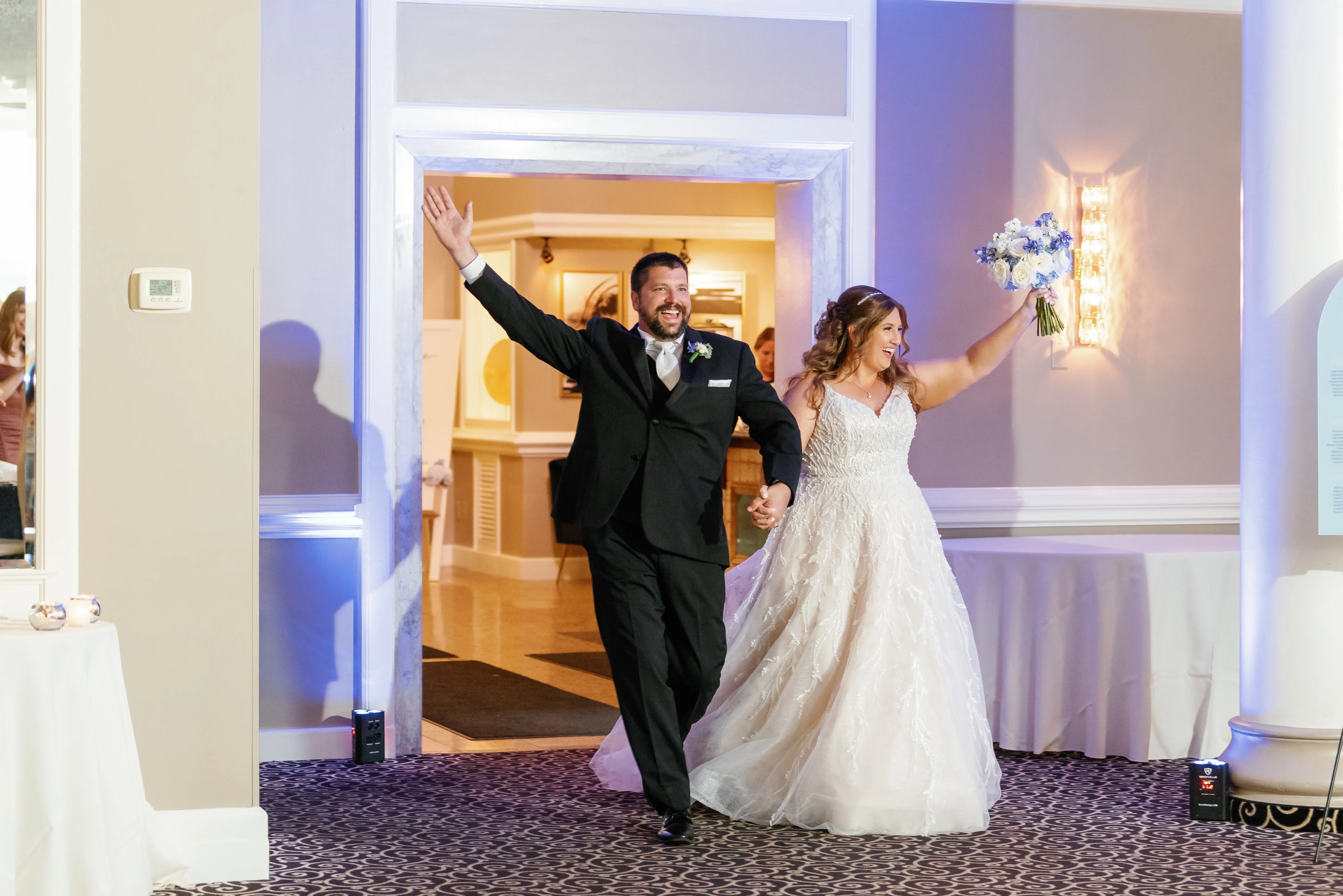 Bride Wearing Beaded Wedding Dress Called Marvine By Sottero And Midgley Walking Into Reception With Groom