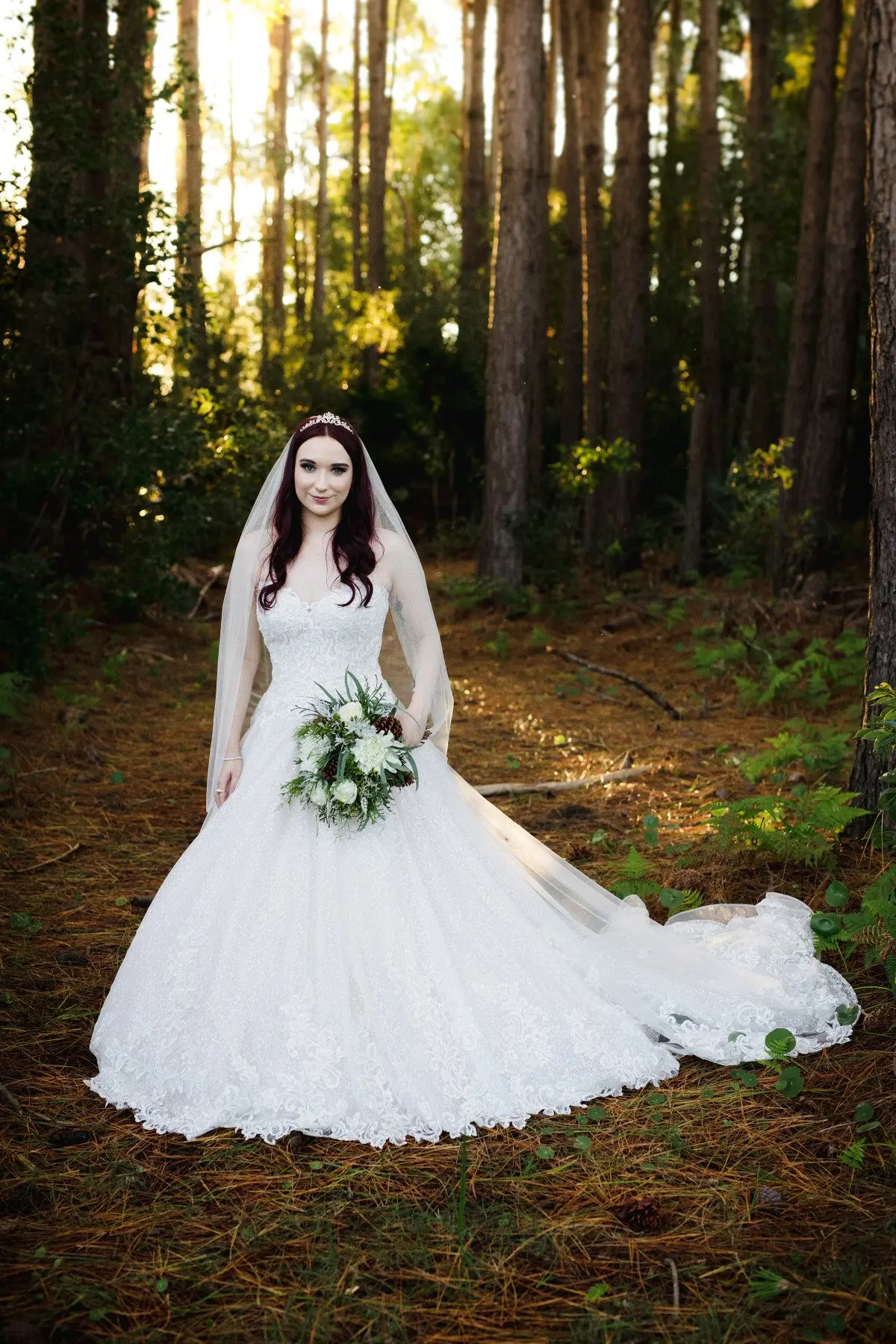 Bride in Lace Ball Gown Wedding Dress with Sequined Tulle and Lace Motifs over Bodice and Statement Hemline called Tristyn by Maggie Sottero