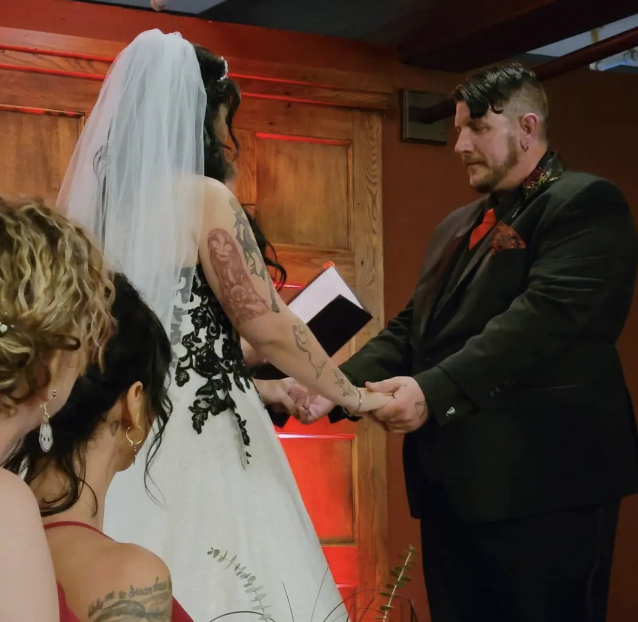Bride wearing Black Lace Ballgown Wedding Dress called Tristyn by Maggie Sottero and groom in their wedding ceremony