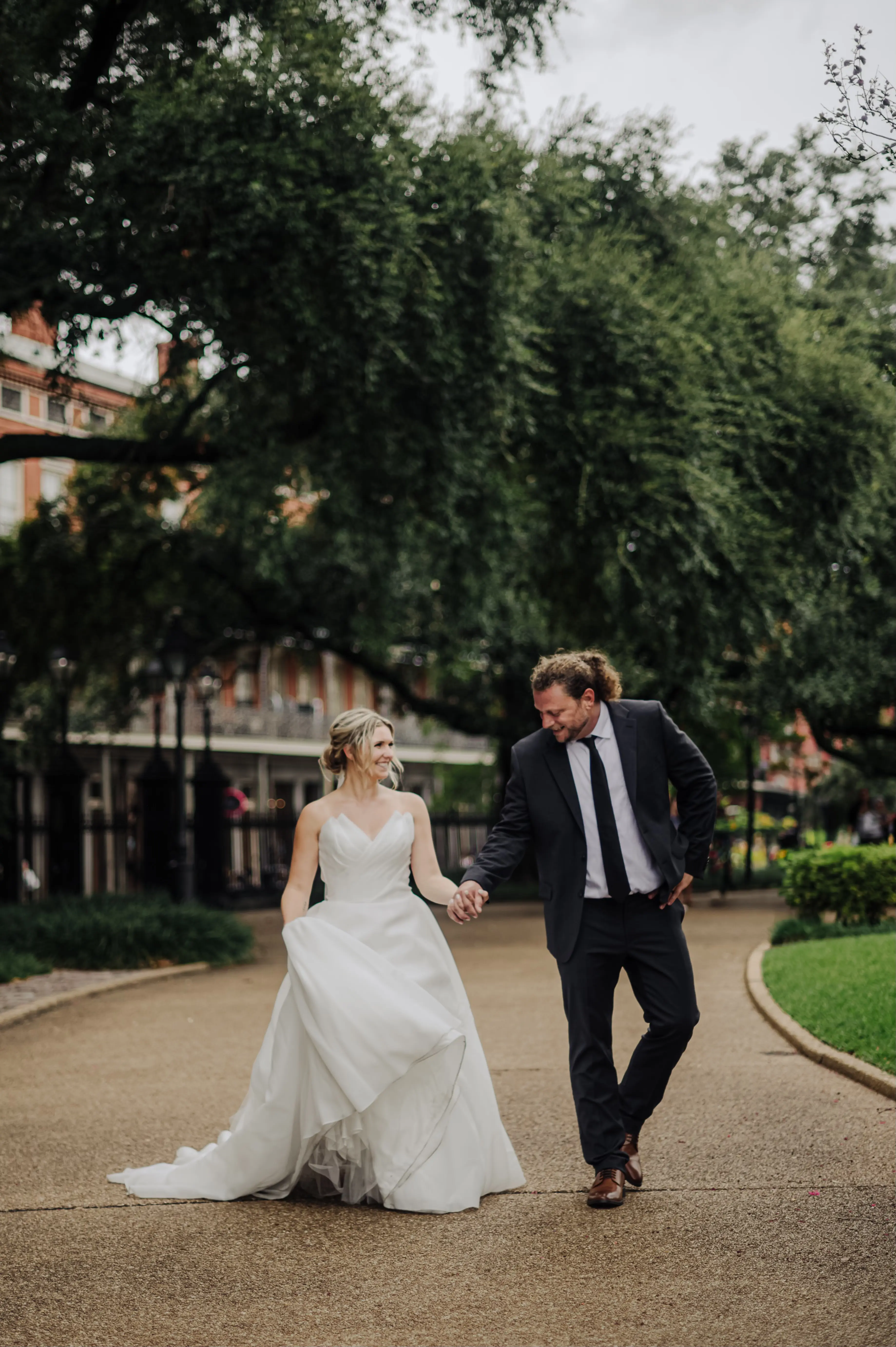 Bride Wearing Modern Princess Wedding Dress Called Aubrielle By Maggie Sottero Walking With Groom