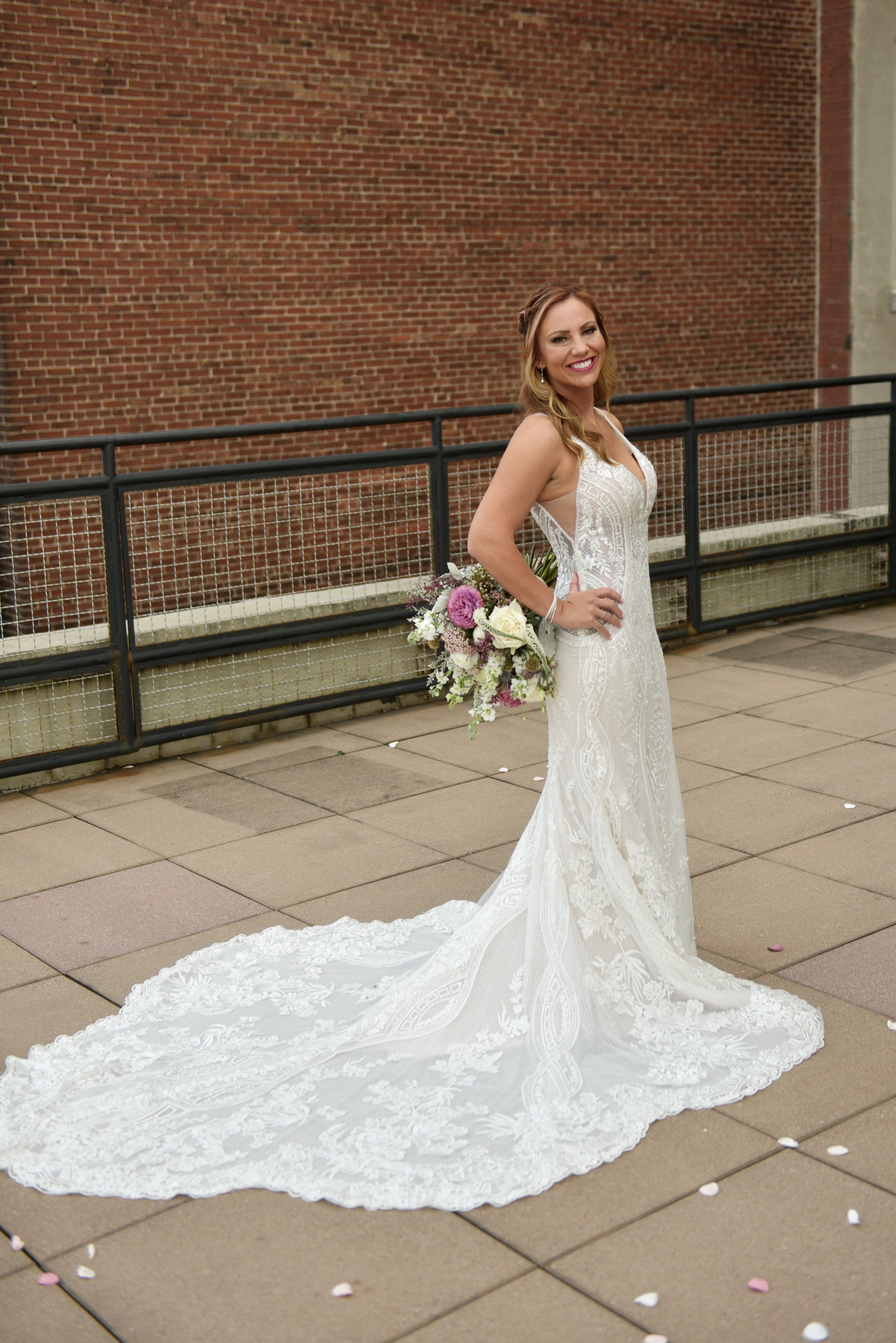 Bride in V-Neckline Wedding Gown Accented with Beaded Detail Called Bailey by Sottero & Midgley