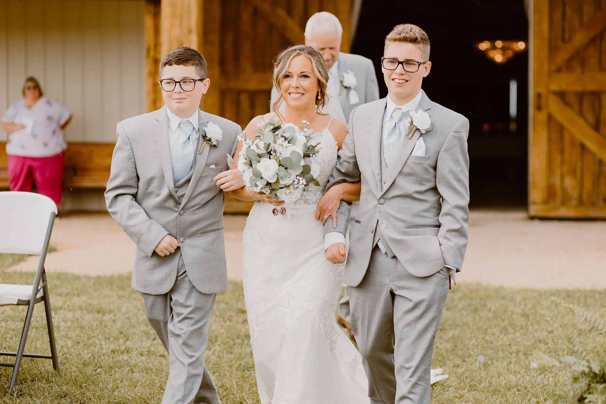 Bride In Floral Wedding Dress Called Fontaine By Maggie Sottero With Family members