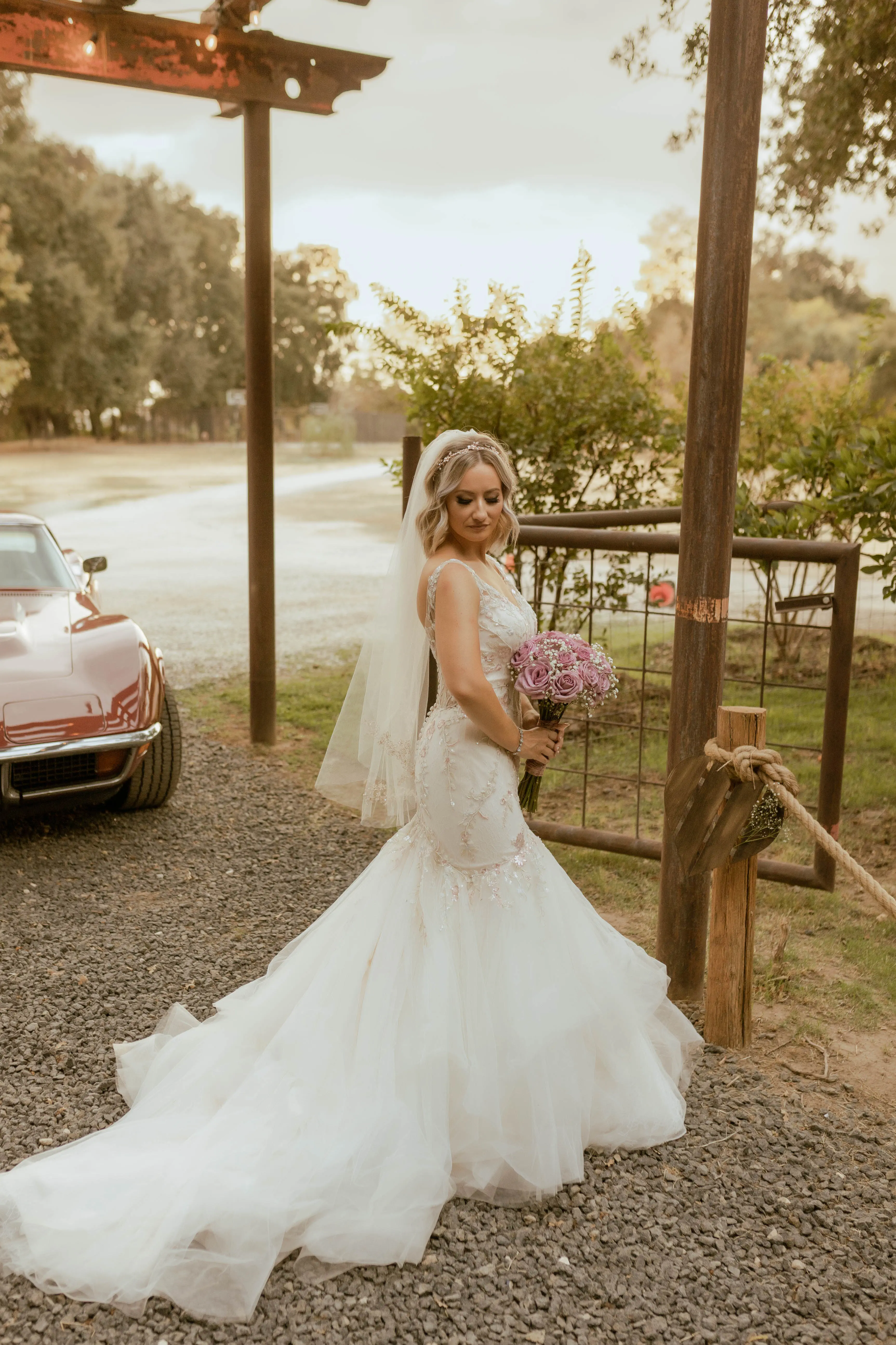 Bride Wearing Pink Lace Mermaid Wedding Dress Called Kenleigh By Sottero And Midgley Holding Pink Bouquet