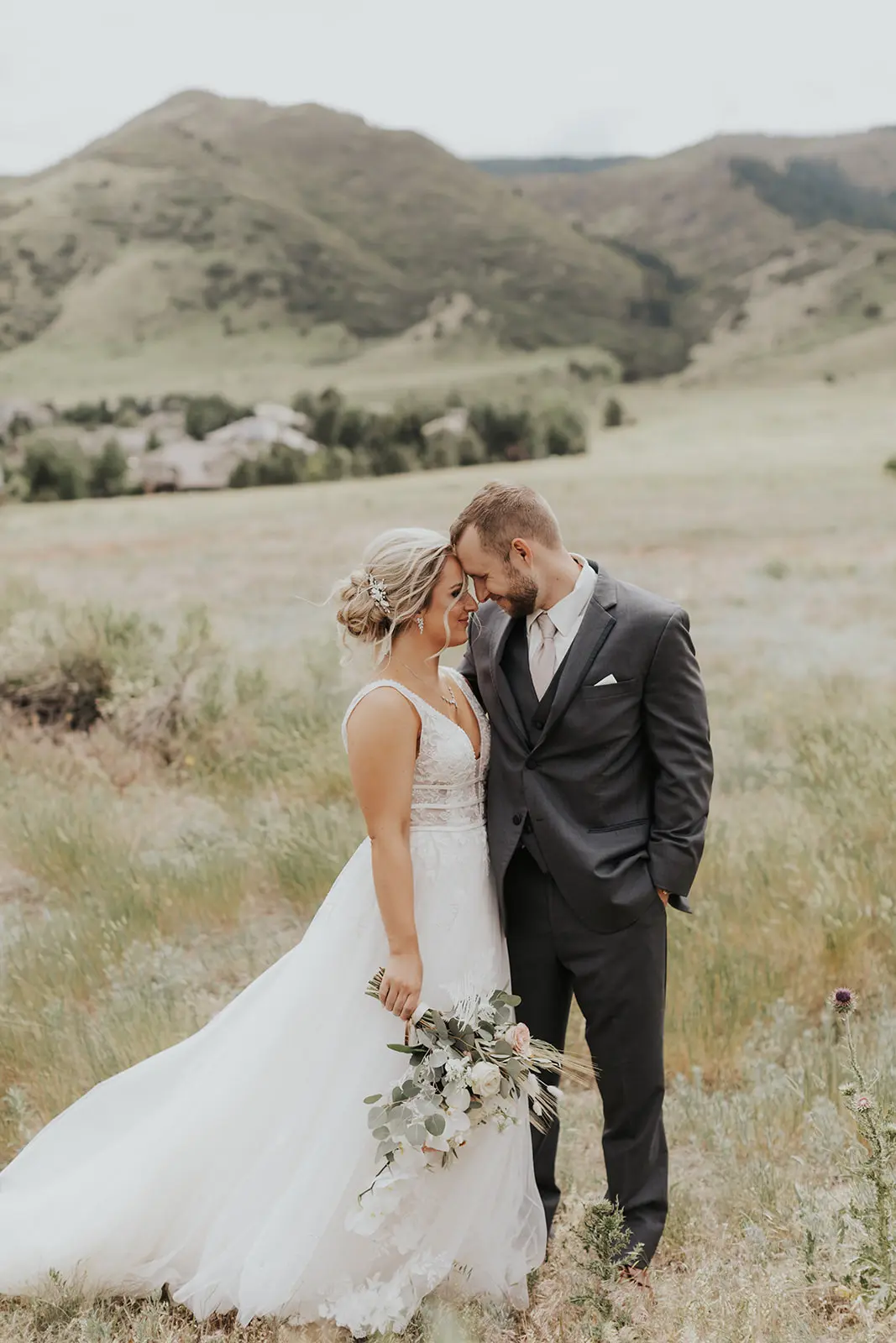 Bride In Lace Backless Wedding Dress Called Raelynn By Rebecca Ingram With Groom