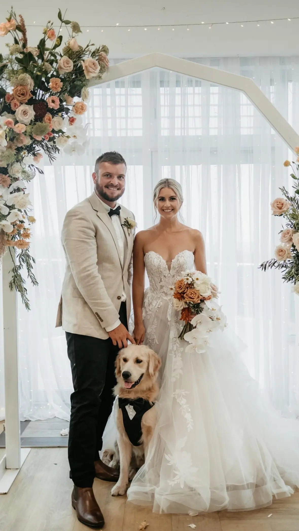 Bride wearing Indiana by Maggie Sottero with her husband and dog