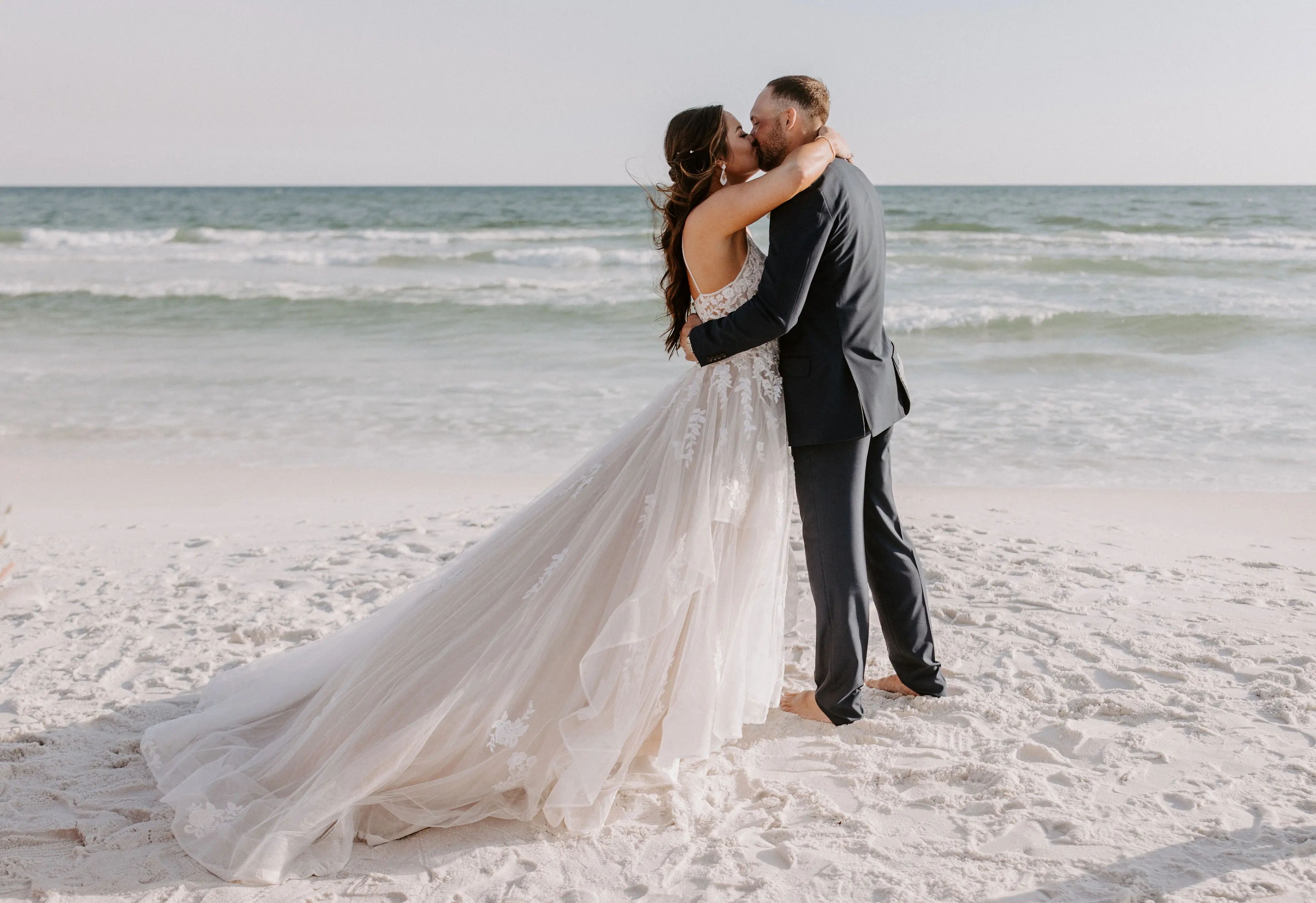 Real Bride wearing A-Line wedding dress with tiered ruffled called Lettie by Rebecca Ingram.