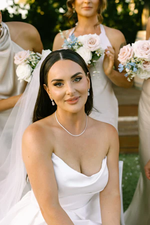 Bride wearing Aspen by Sottero and Midgley in front of her bridesmaids