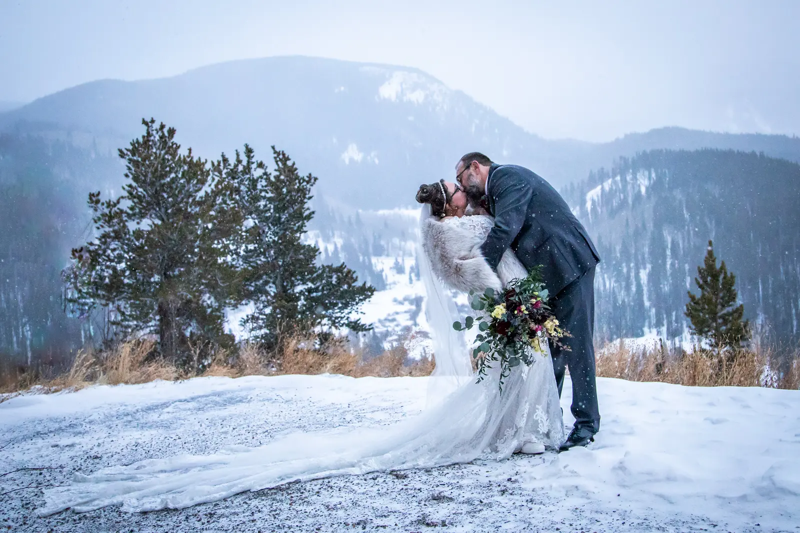 Bride In Lace Winter Wedding Dress Called Edison By Maggie Sottero With Groom