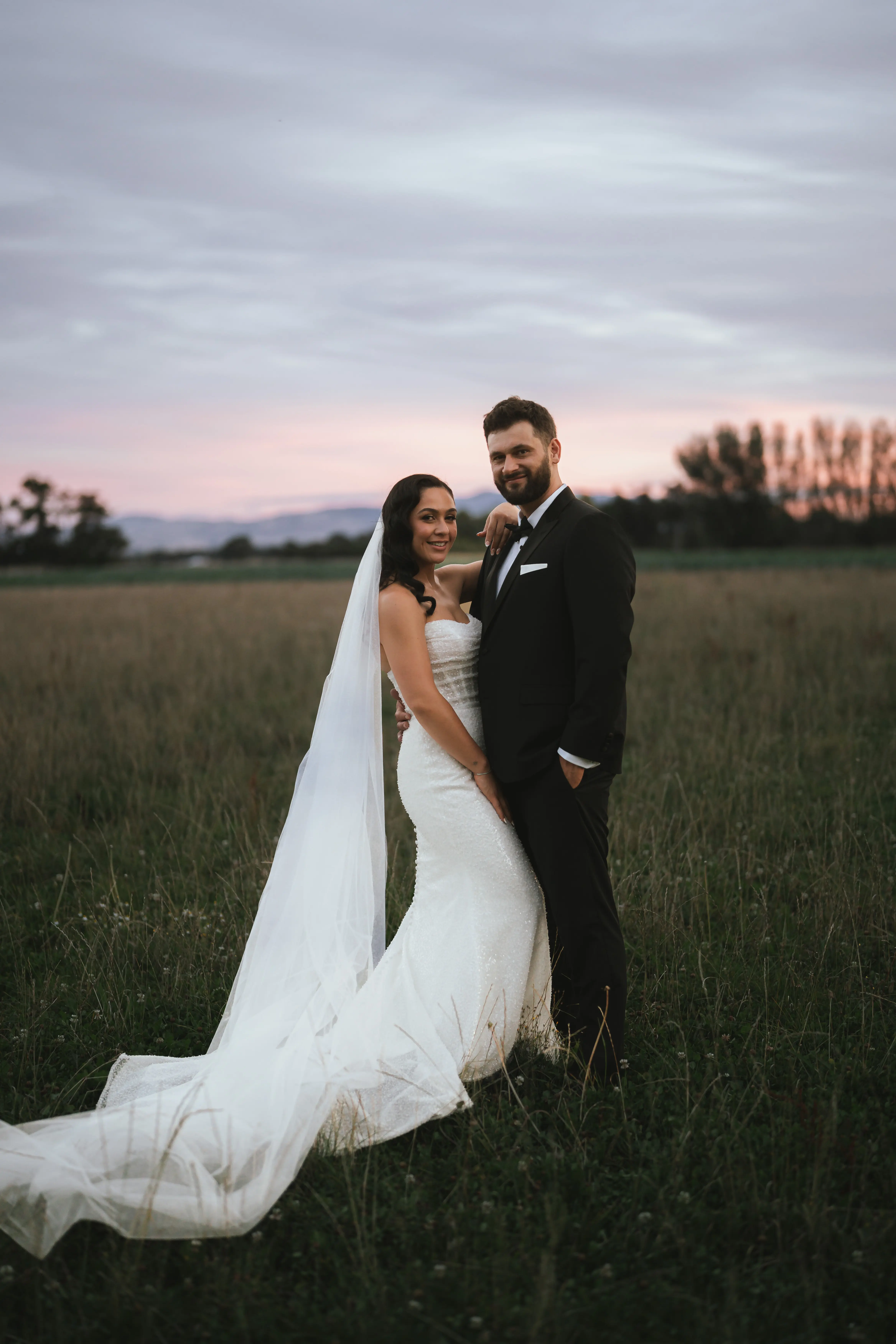 Bride wearing Drew by Maggie Sottero and her husband
