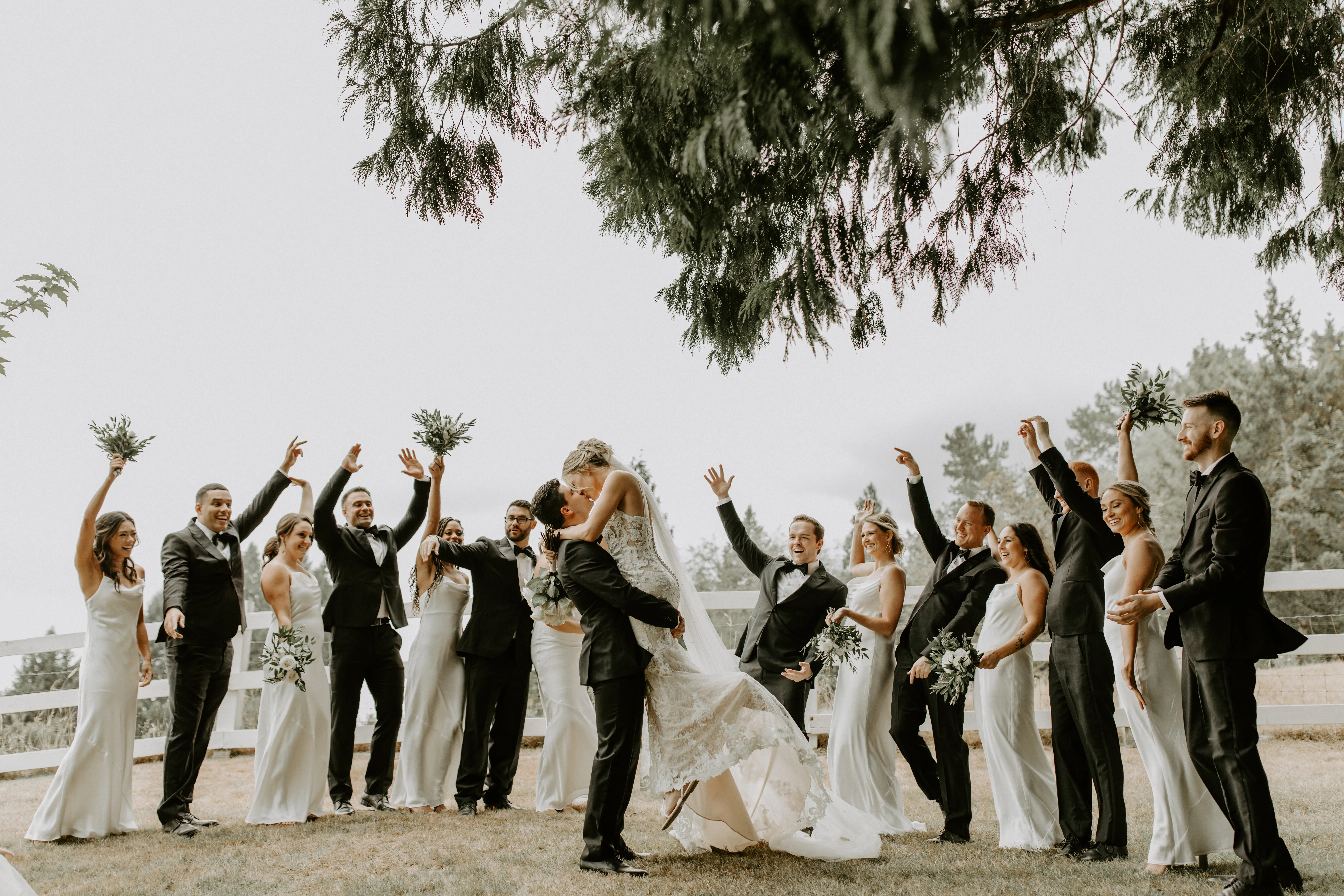 Bride with groom wearing romantic lace sheath wedding dress