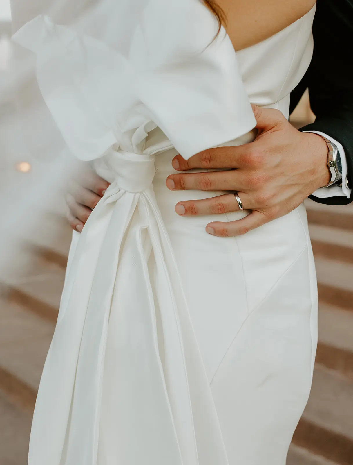 Bride Wearing Strapless Wedding Dress Featuring Big Bow Mitchell By Maggie Sottero