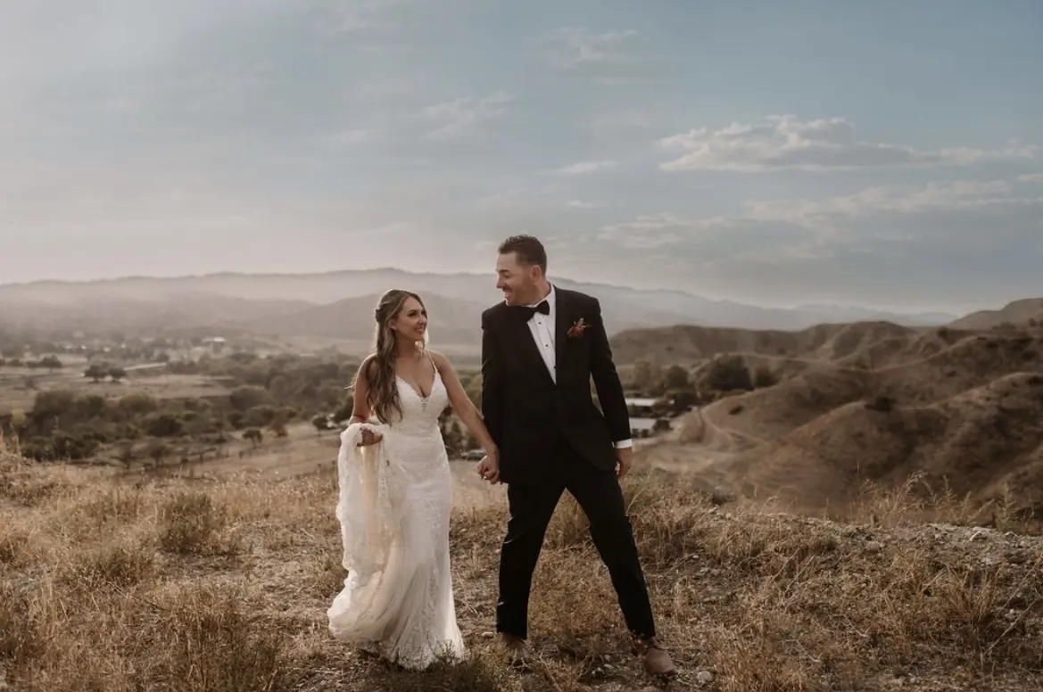 Bride In Beaded Fit-And-Flare Wedding Dress Called Barrett By Sottero And Midgley With Groom