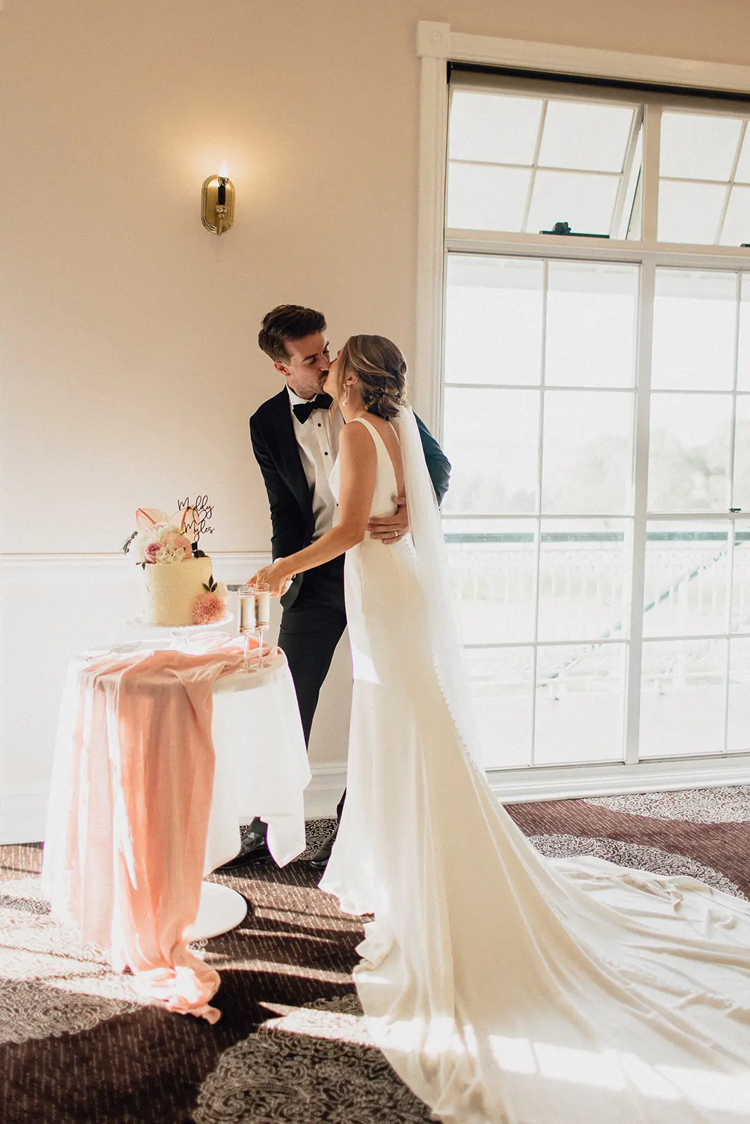 Groom With Bride Wearing Minimalist Crepe Fit-And-Flare Wedding Dress Fernanda By Maggie Sottero