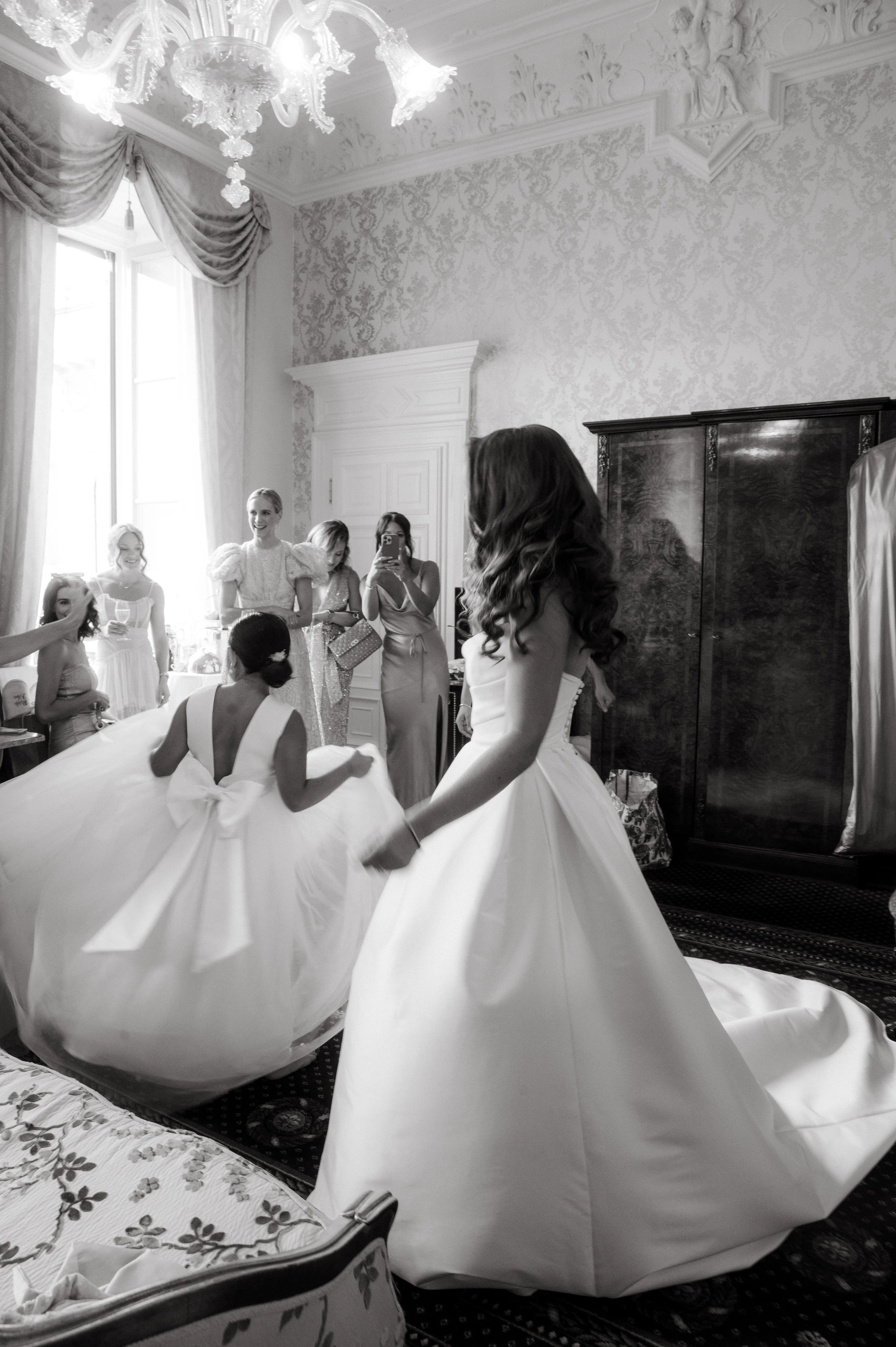 Bride wearing Aspen by Sottero and Midgley getting ready with her bridesmaids