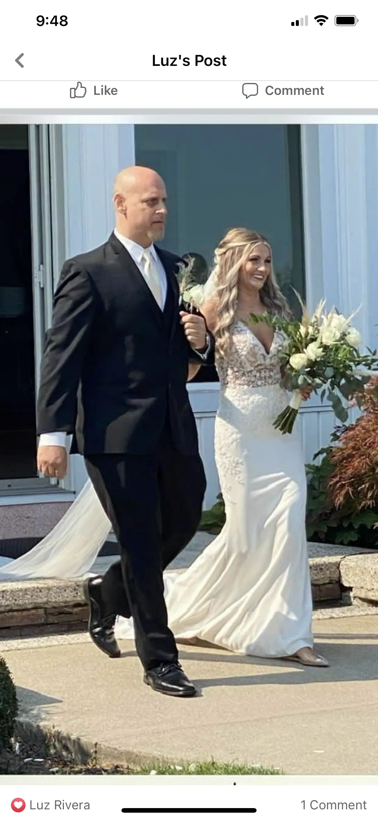 Bride with father wearing sexy v back sheath wedding dress