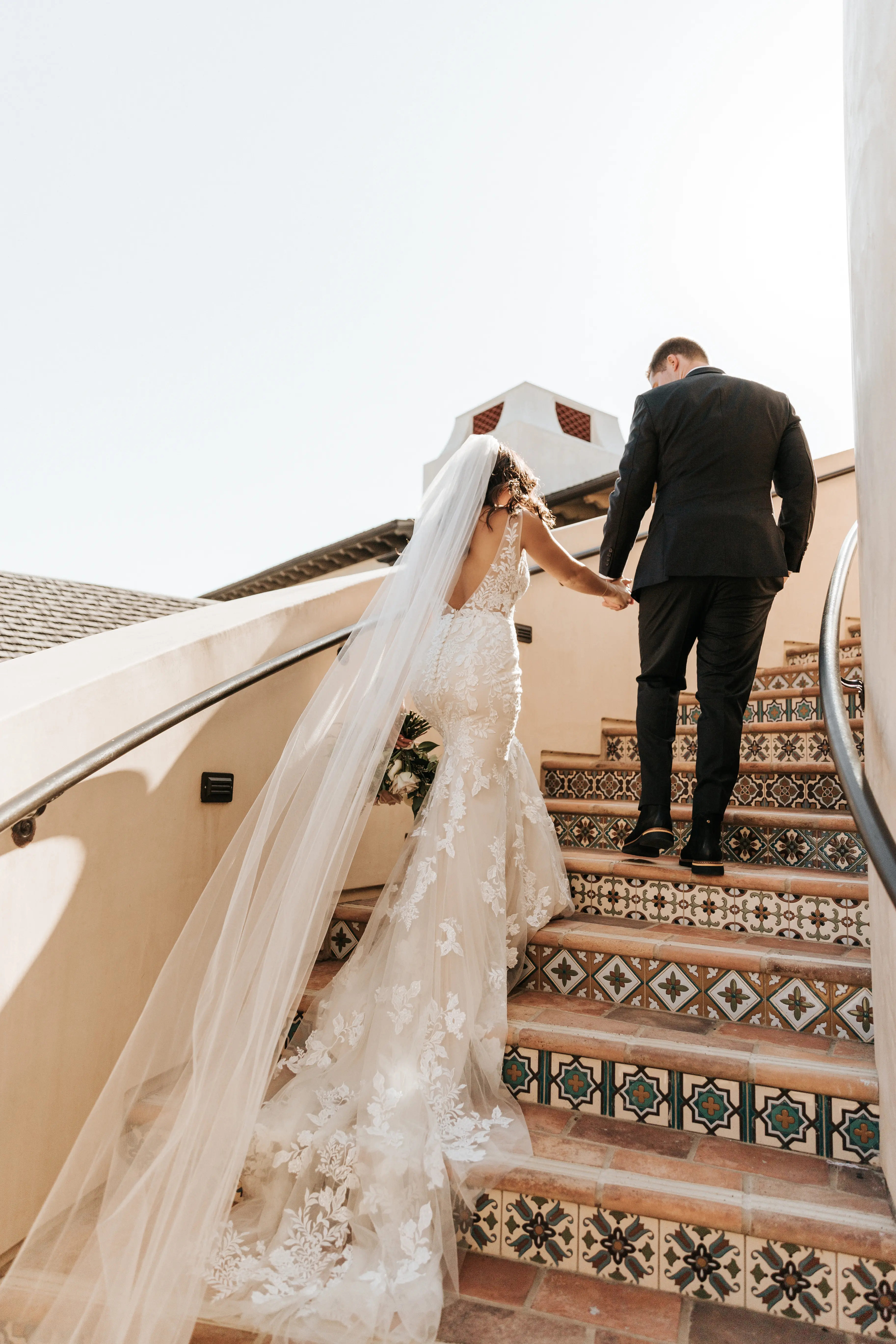 Bride with groom wearing floral fit and flare wedding dress
