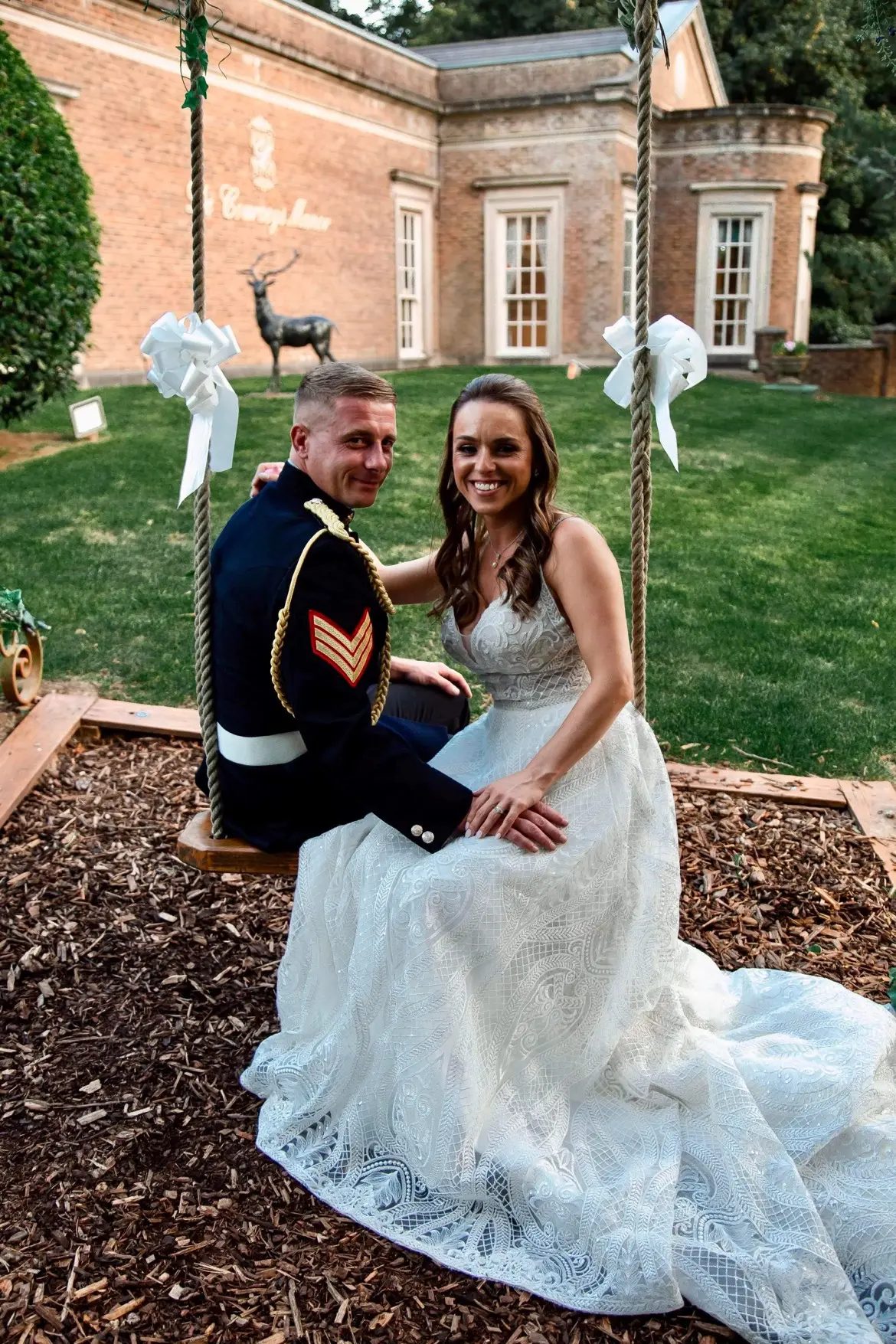 Bride Wearing Boho Lace Wedding Dress Called Roxanne By Sottero And Midgley Sitting On A Swing With Groom