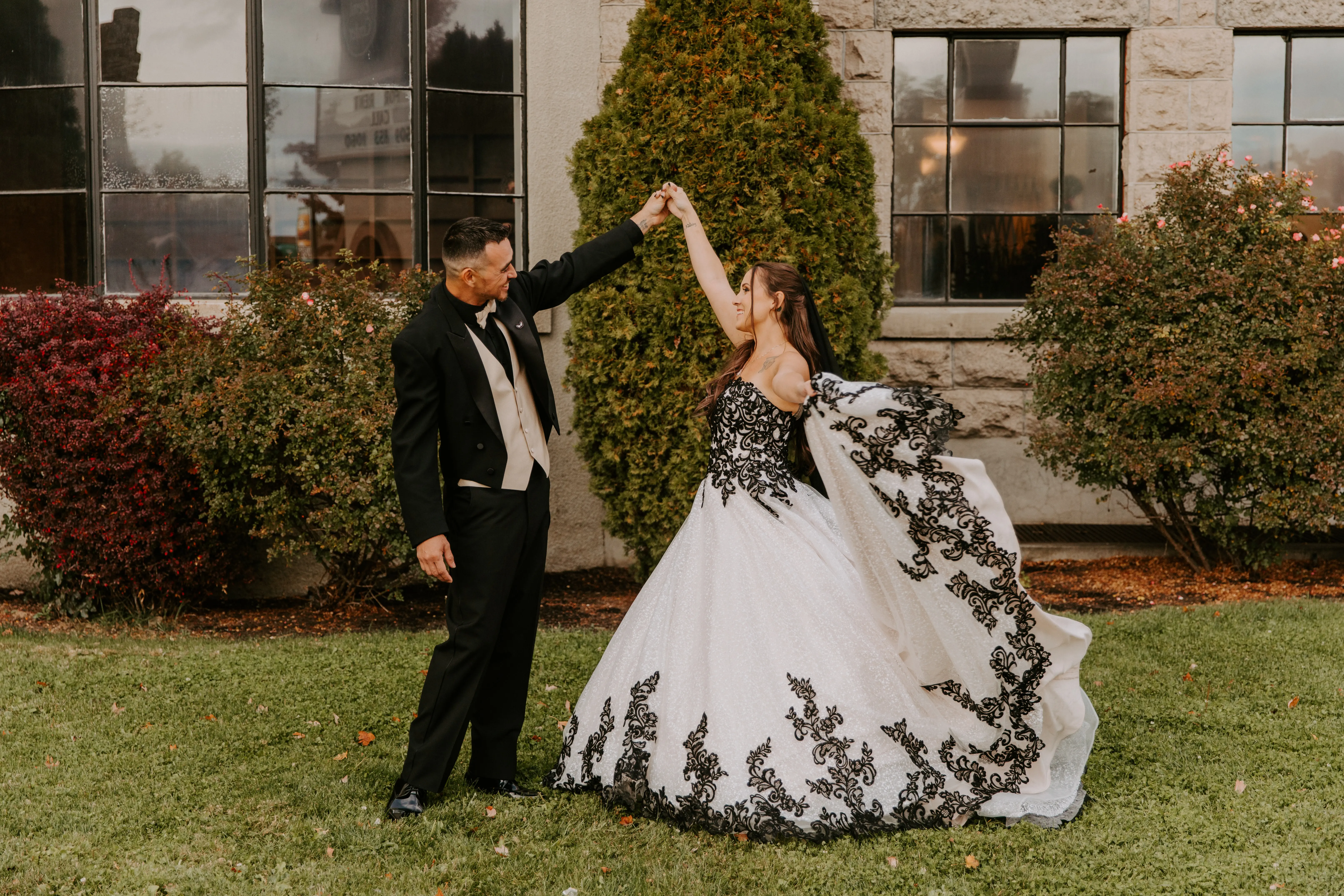 Bride wearing Black Lace Ballgown Wedding Dress called Tristyn by Maggie Sottero with her groom