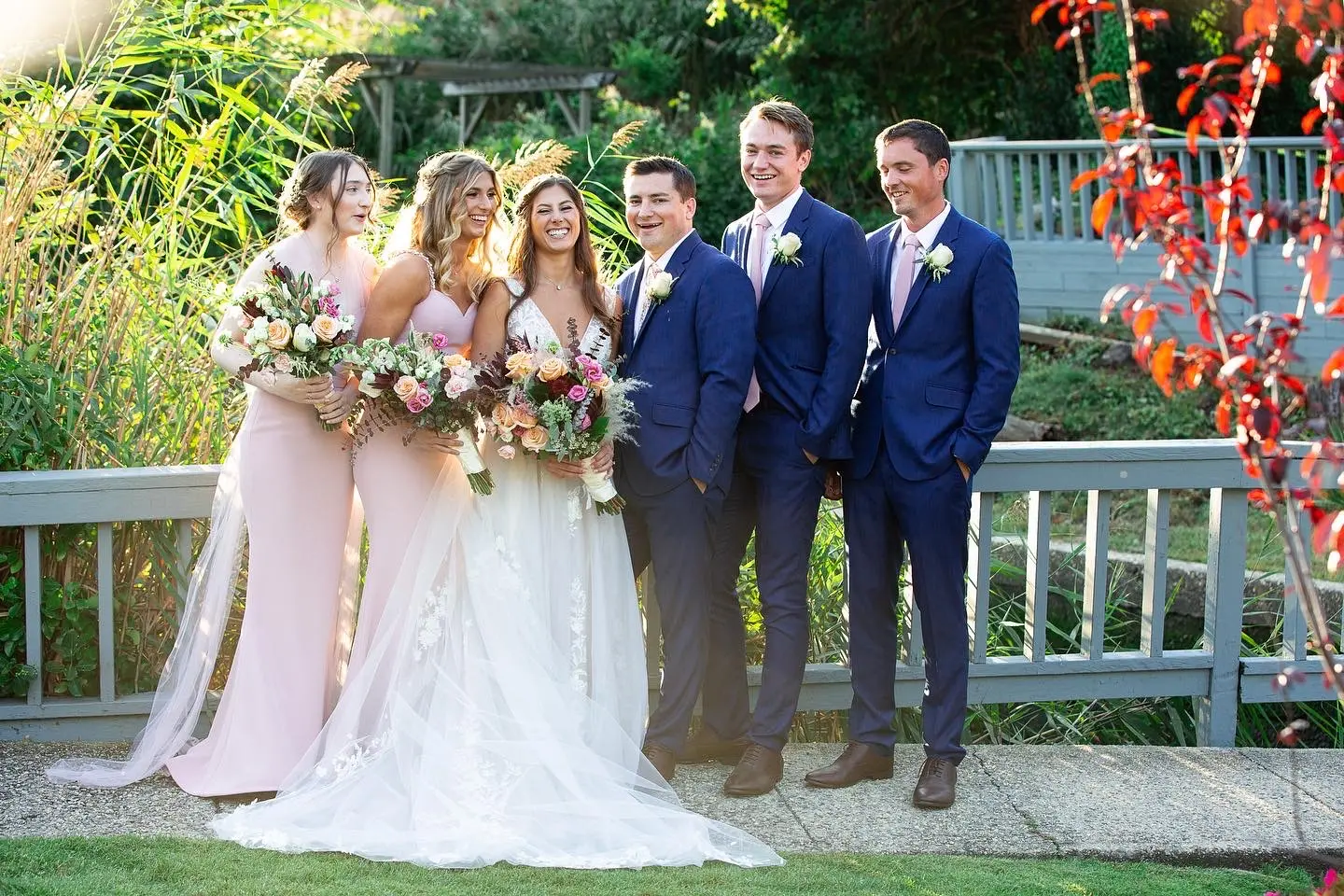 Bride, Groom, and wedding party with Bride wearing Lace A-line Wedding Dress called Raelynn by Rebecca Ingram