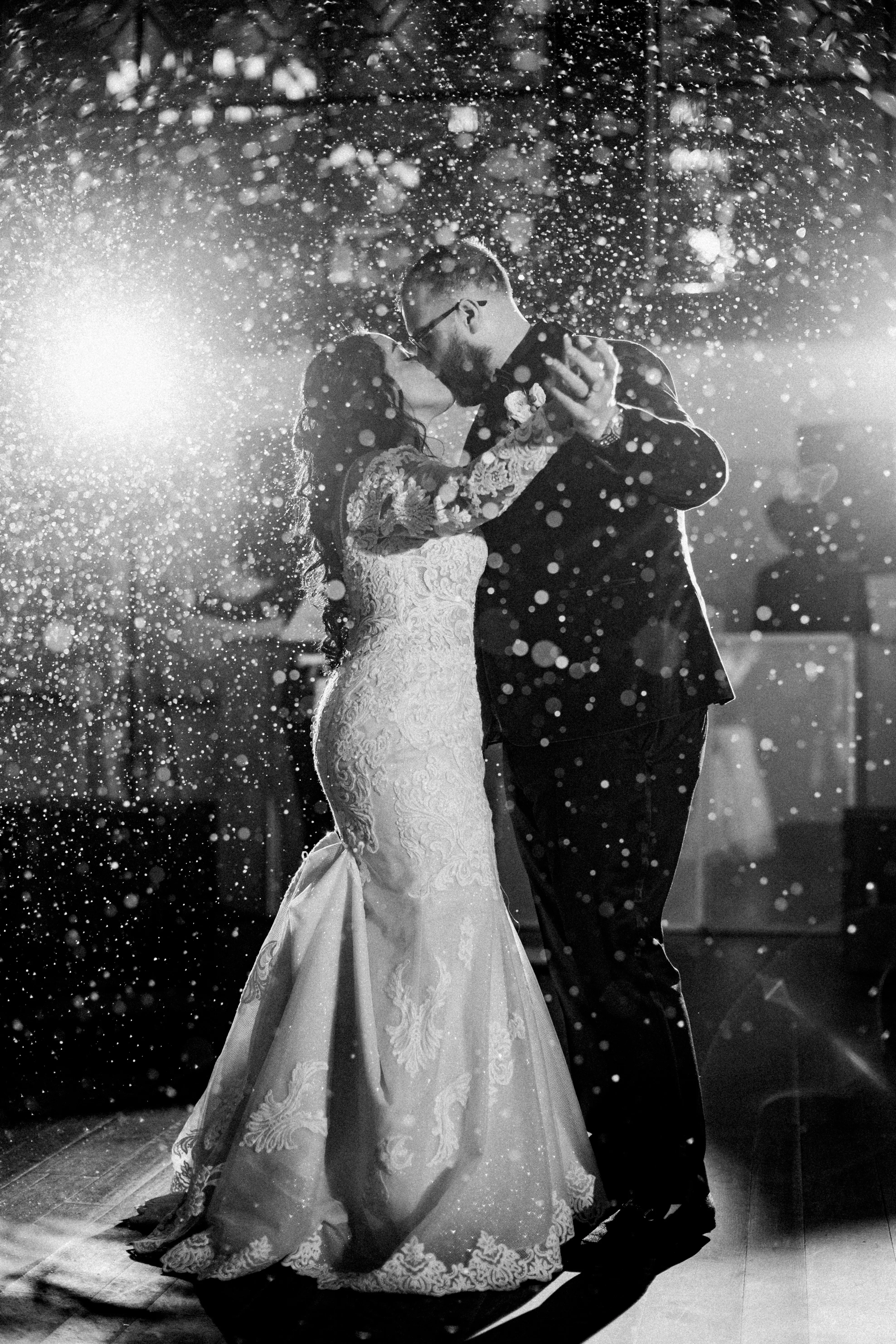 Bride Wearing Sexy Lace Wedding Dress Called Fiona By Maggie Sottero With Snow Falling Around Them