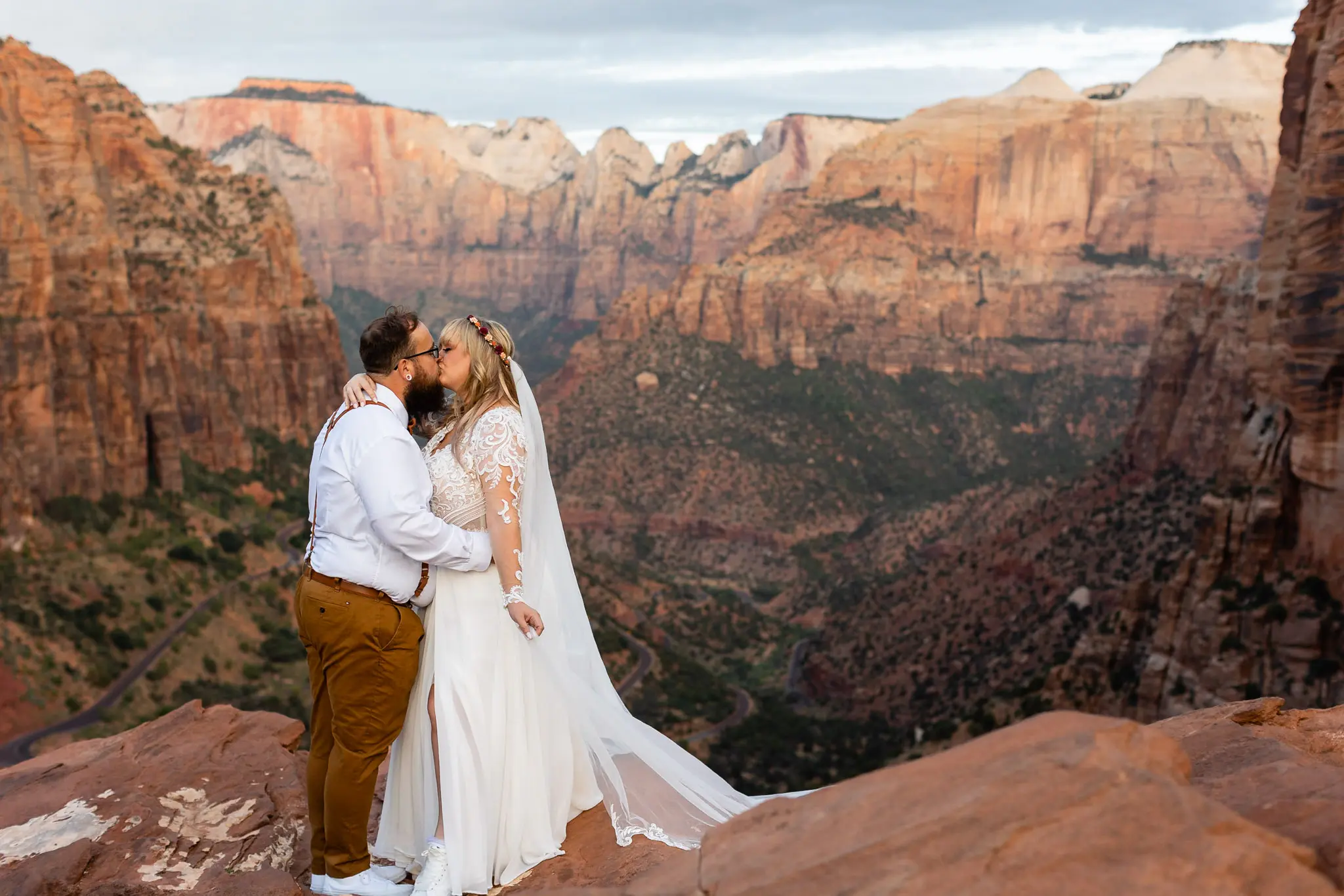 Real Bride in Long Sleeved, Thigh-High Slit Wedding Dress Named Lorraine by Rebecca Ingram with Groom