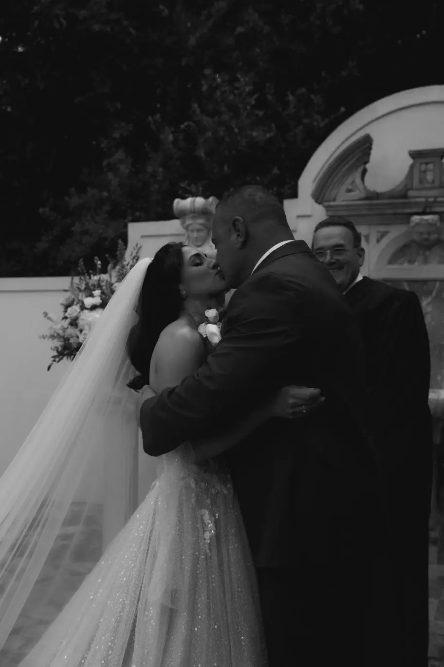Bride And Groom Share First Kiss. Bride Wearing Sparkly Fairytale Ball Gown Wedding Dress Called Shasta By Sottero And Midgley