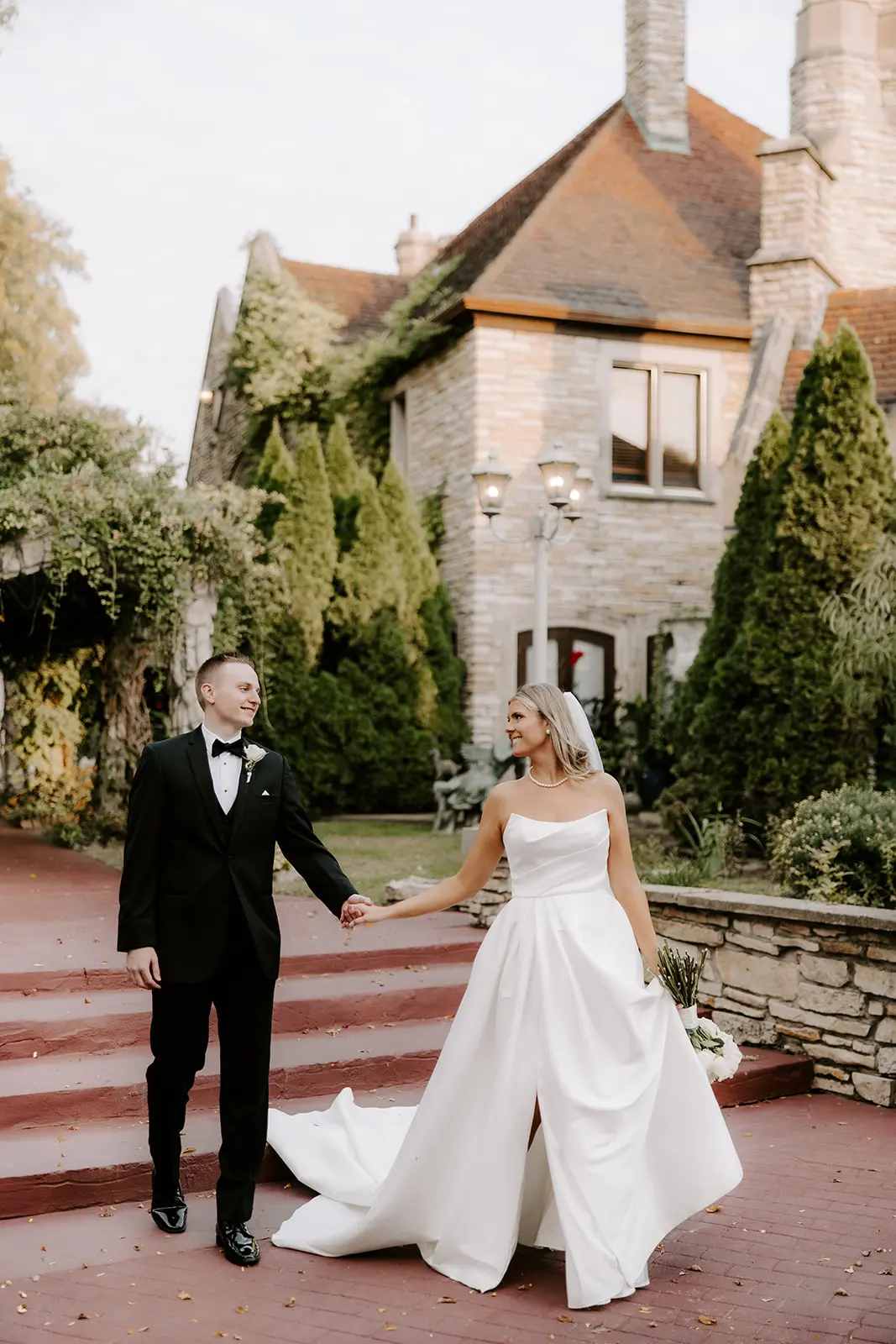 Bride Wearing Simple Aline Wedding Dress Called Aspen By Sottero And Midgley Holding Hands And Walking With Groom