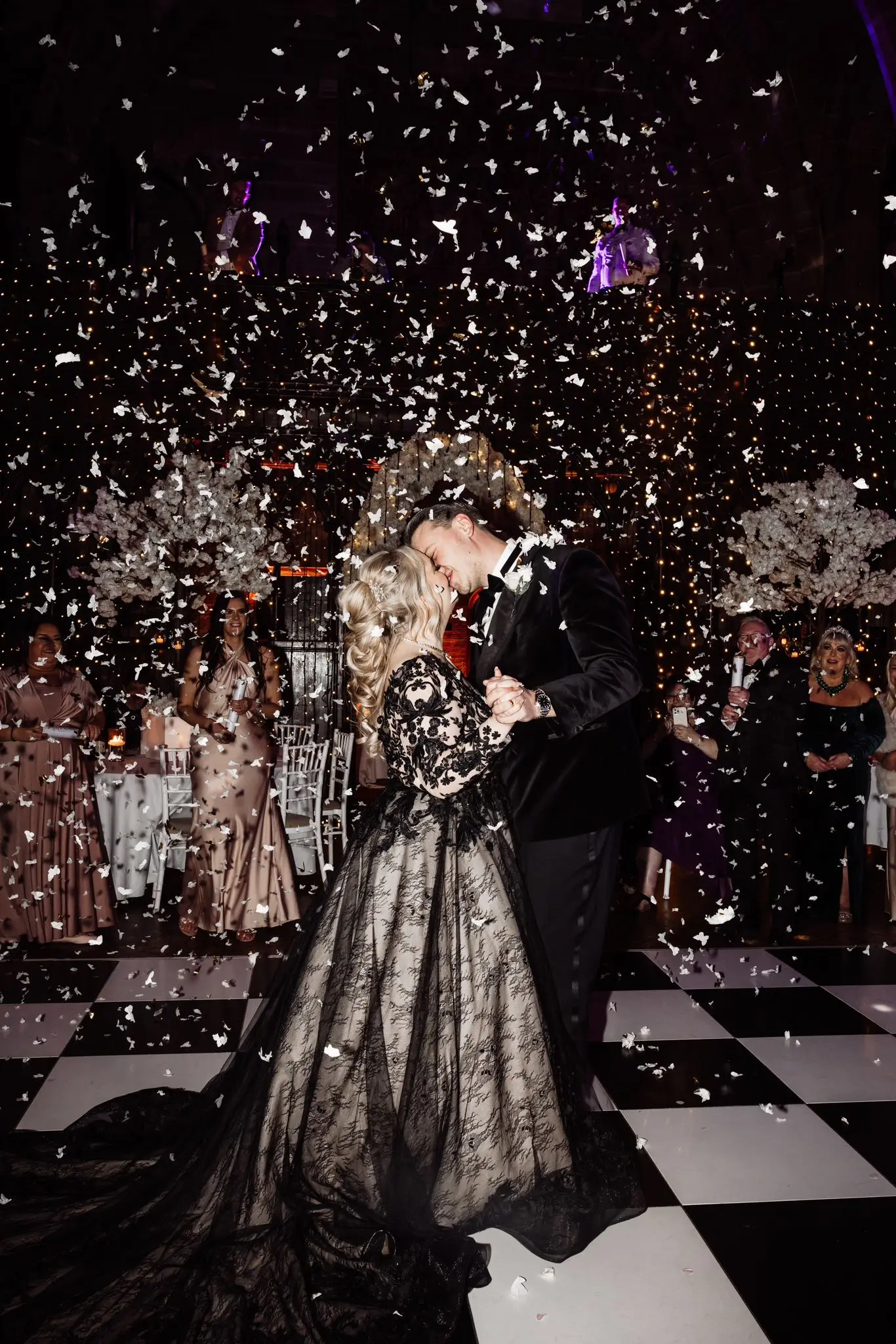Bride Wearing Black Lace Ballgown Wedding Dress Called Zander By Sottero And Midgley Kissing Groom At Reception