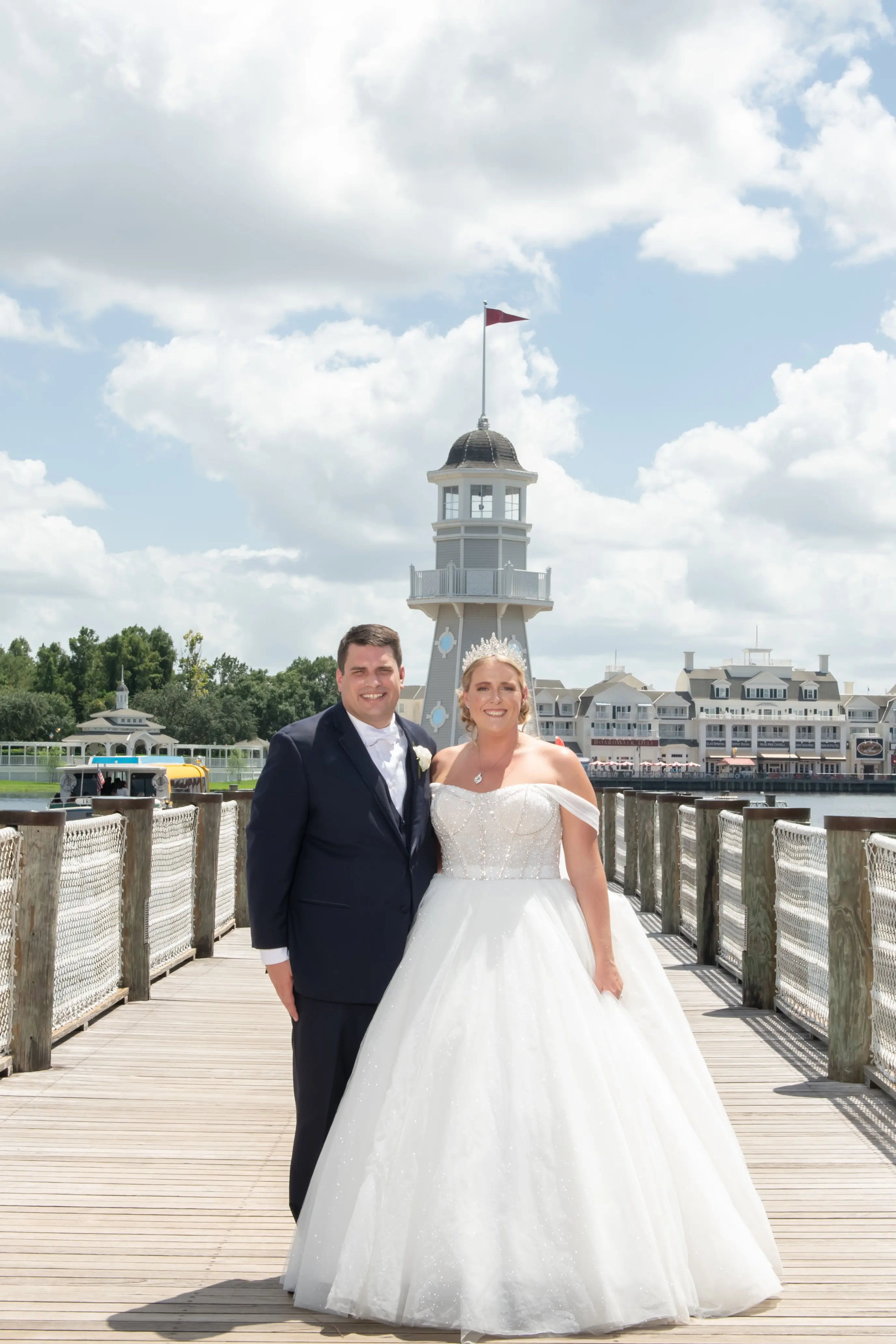 Bride wearing Elton wedding dress by Sottero and Midgley with her husband