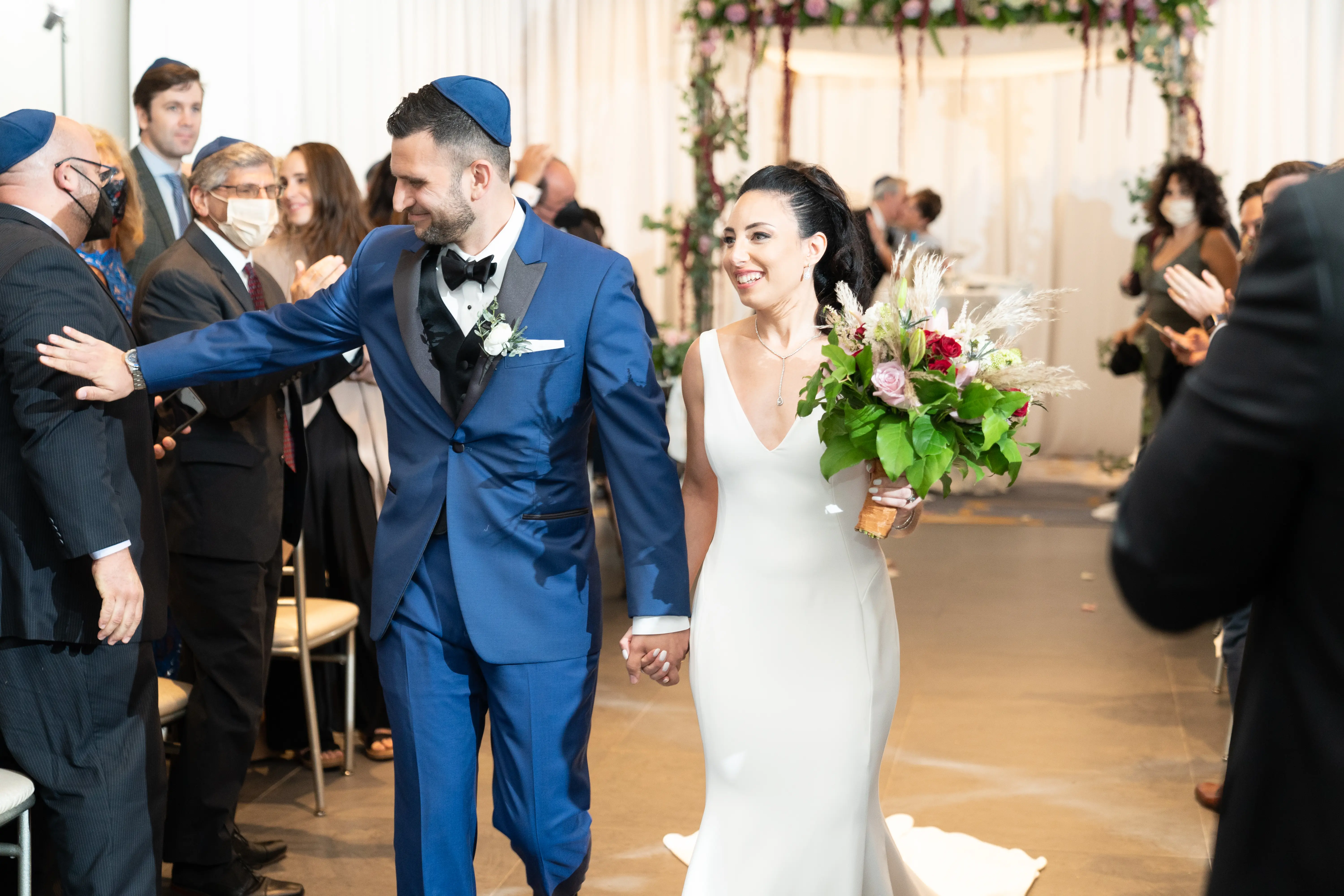 Bride with groom wearing simple fit and flare crepe wedding dress