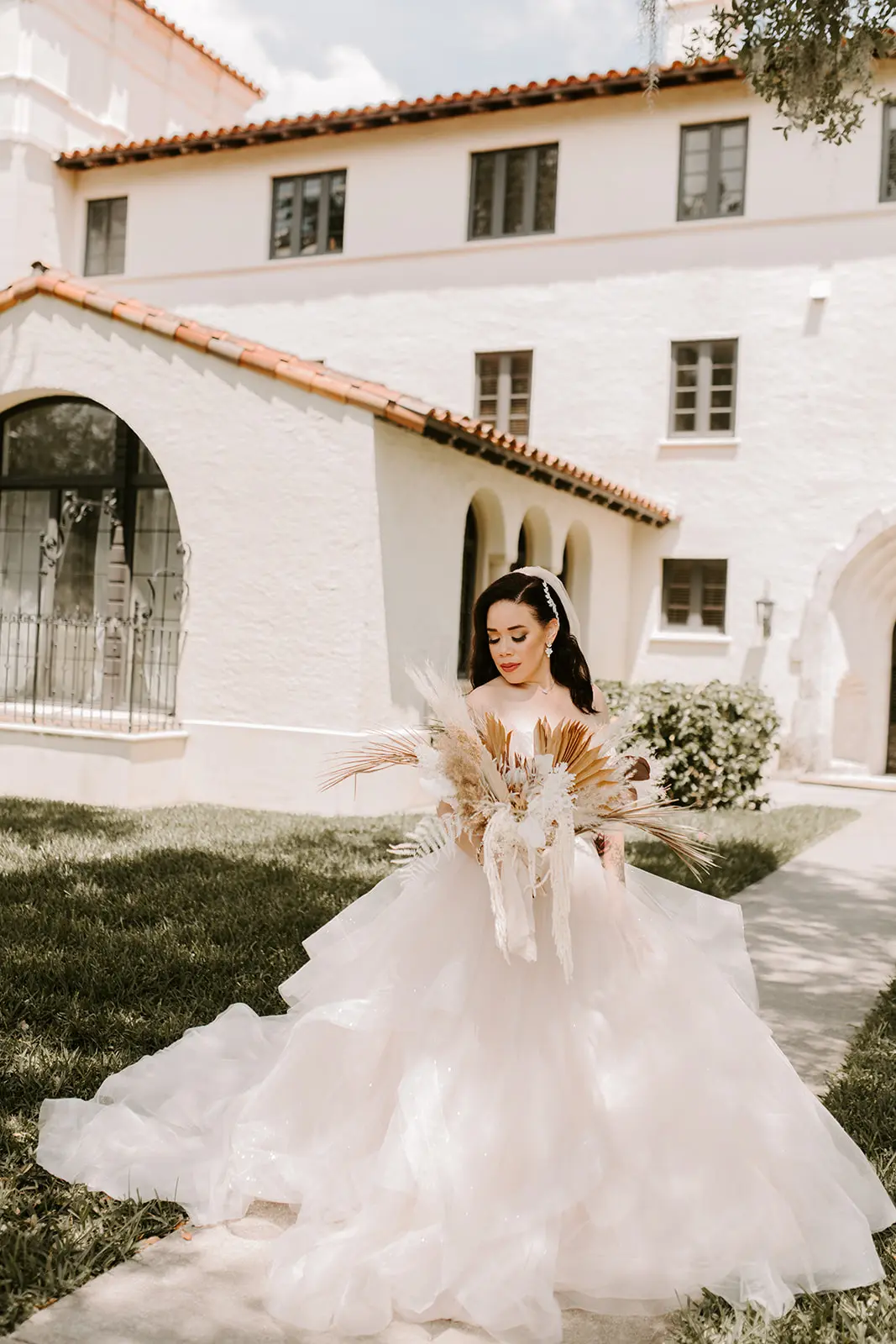 Bride wearing strapless tulle ballgown wedding dress