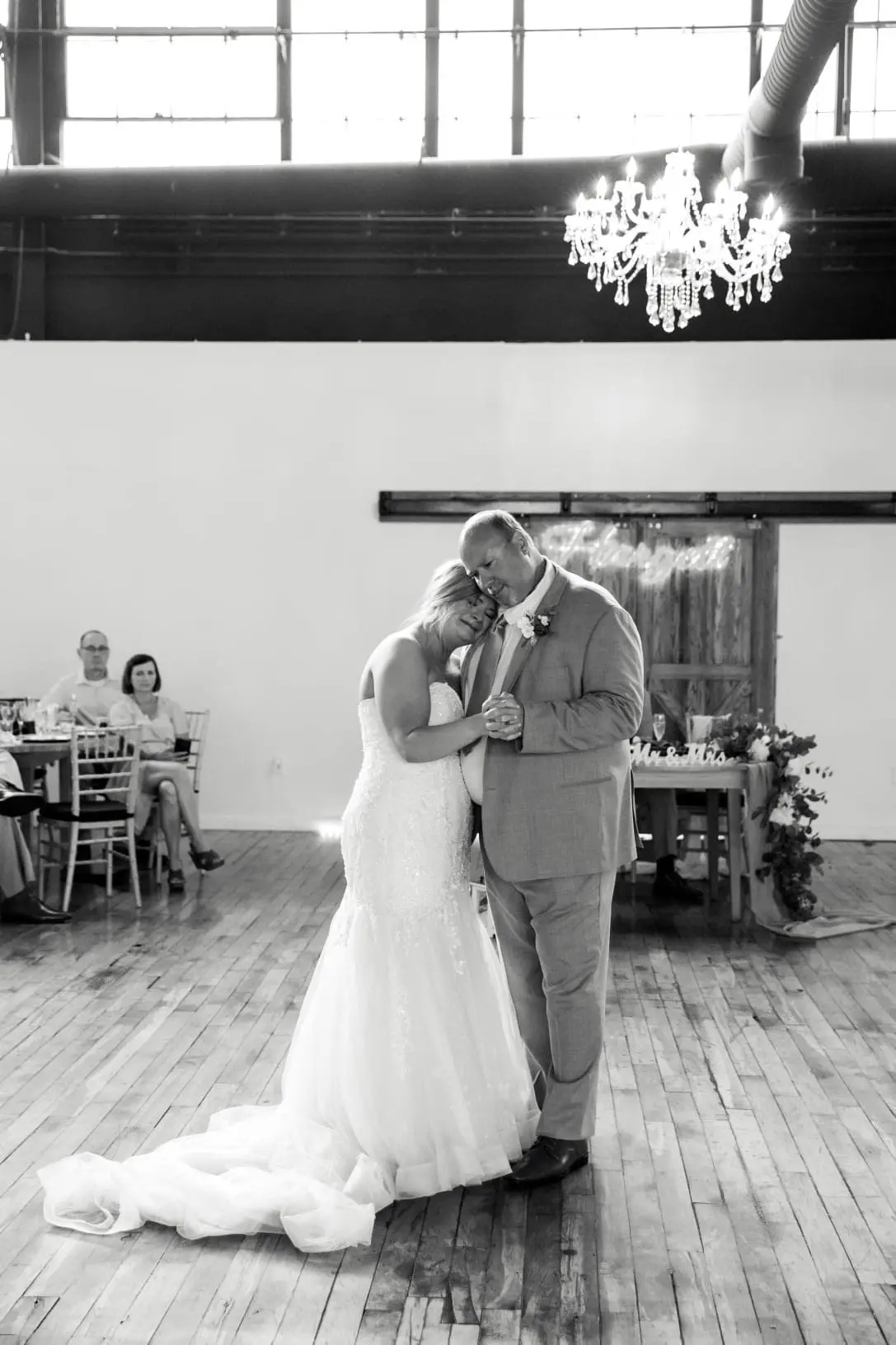 Bride wearing glamorous plus size mermaid wedding dress