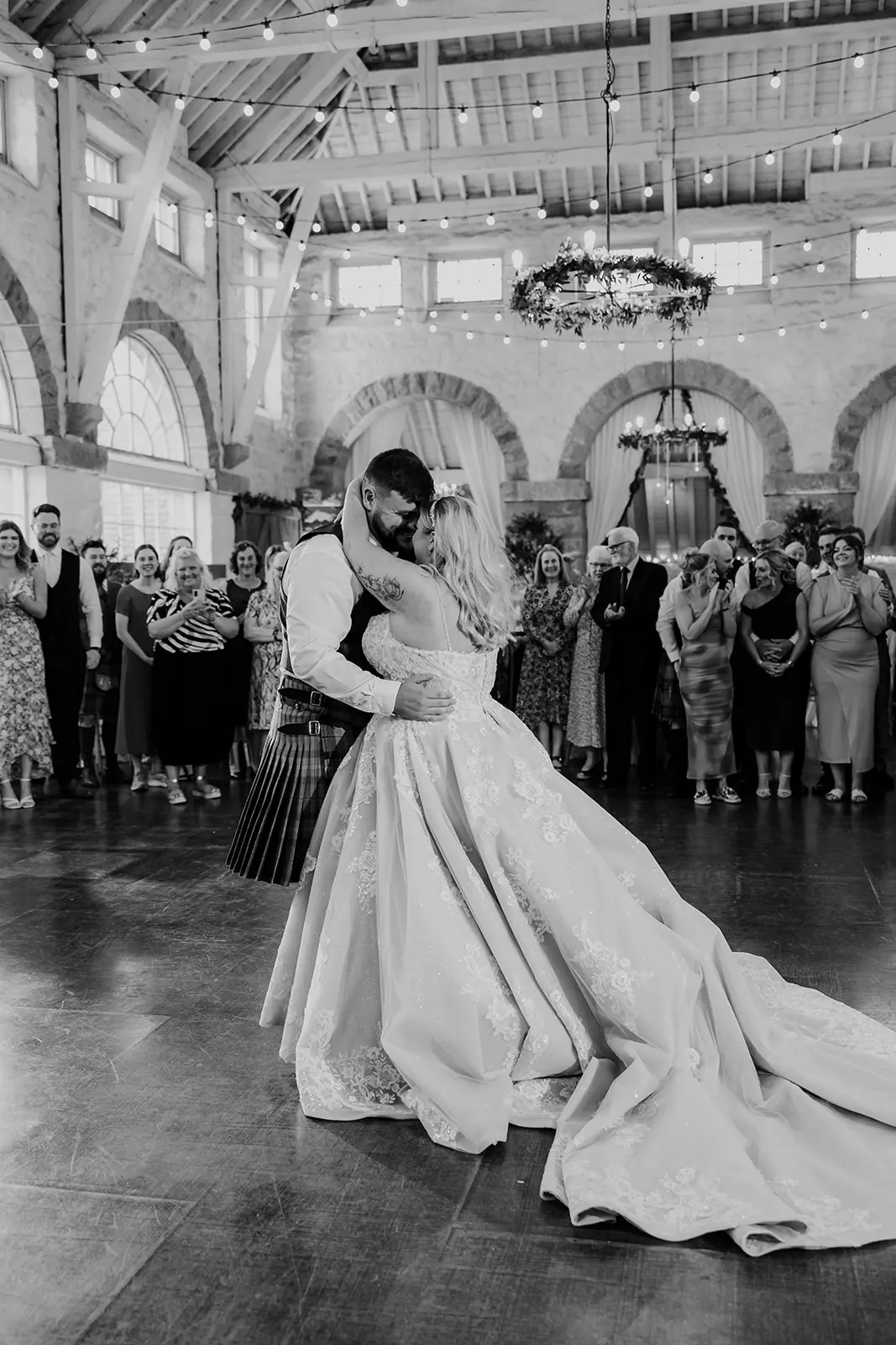 Bride wearing Norvinia by Sottero and Midgley dancing with her husband