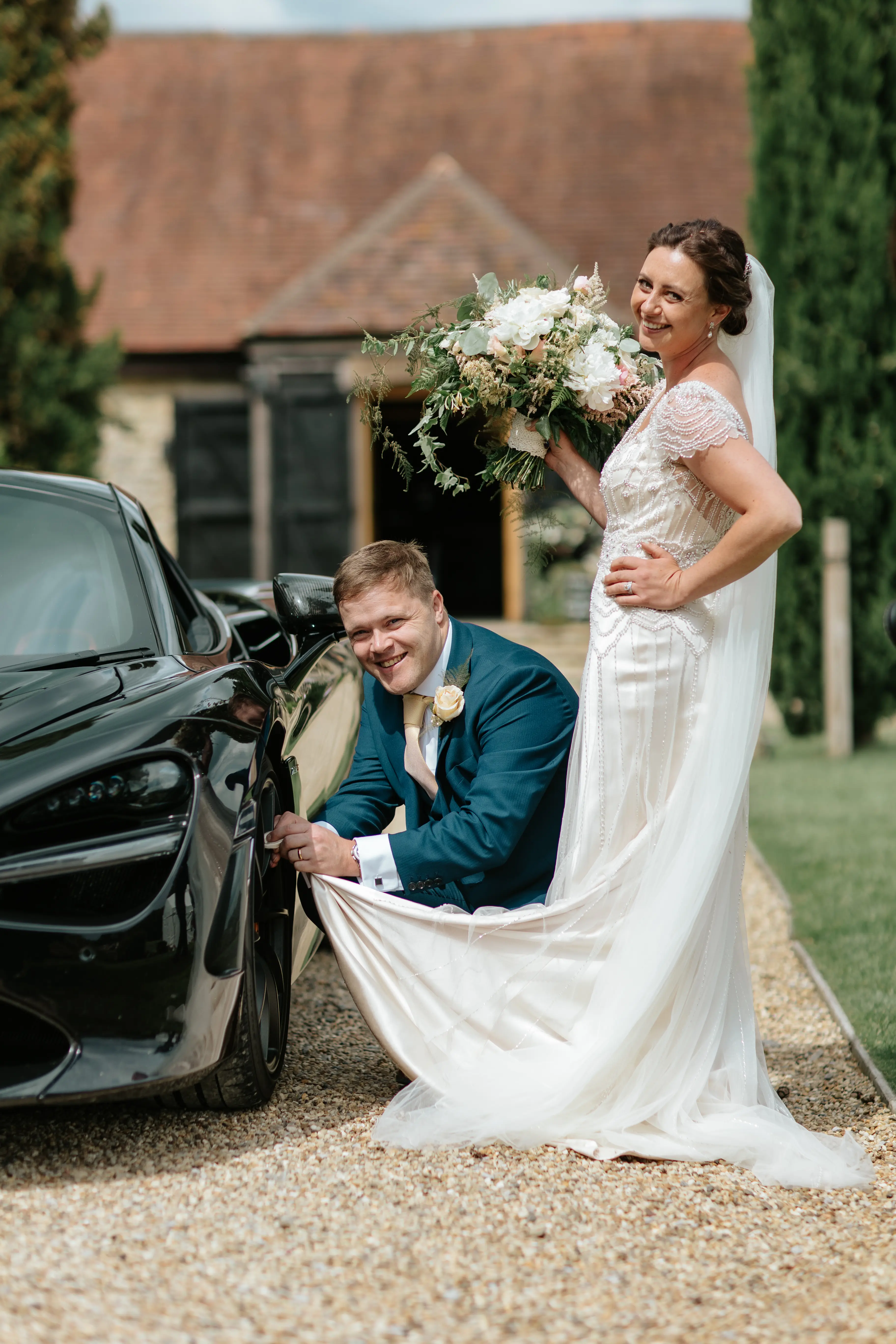 Groom With Bride Wearing Ivory Satin Sheath Wedding Dress Ettia By Maggie Sottero