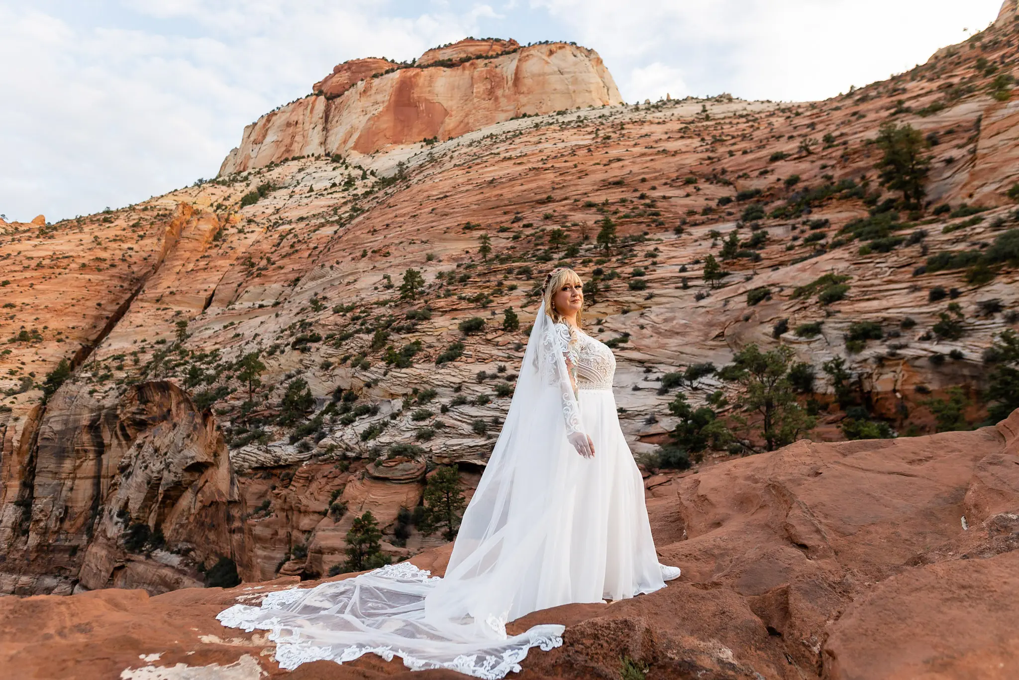 Real Bride in Long Sleeved, Thigh-High Slit Wedding Dress Named Lorraine by Rebecca Ingram