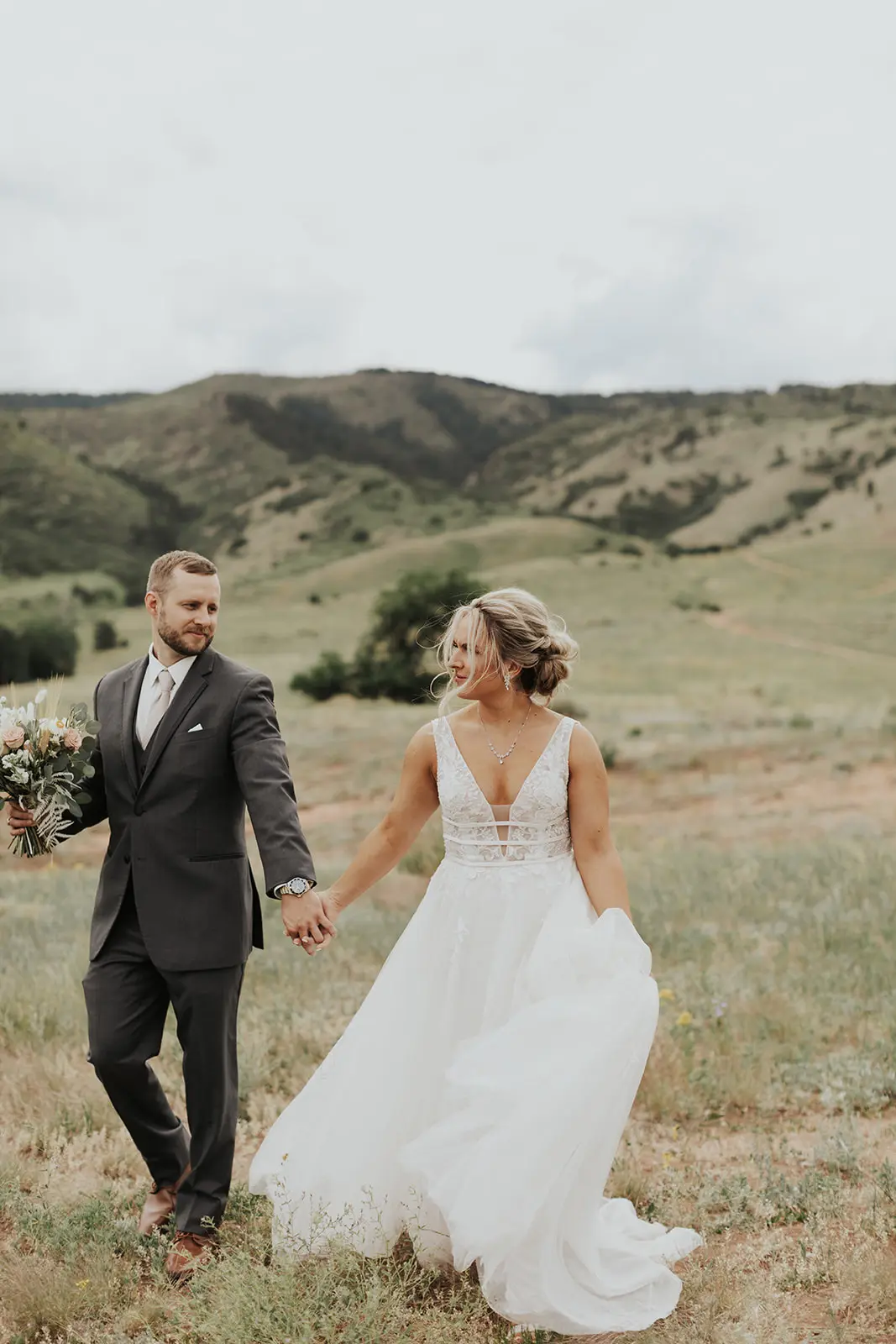Bride In Lace Backless Wedding Dress Called Raelynn By Rebecca Ingram With Groom