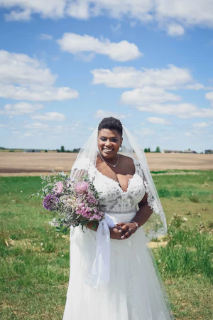 Bride Wearing Sexy Lace Bridal Gown Called Chauncey By Sottero And Midgley In A Field