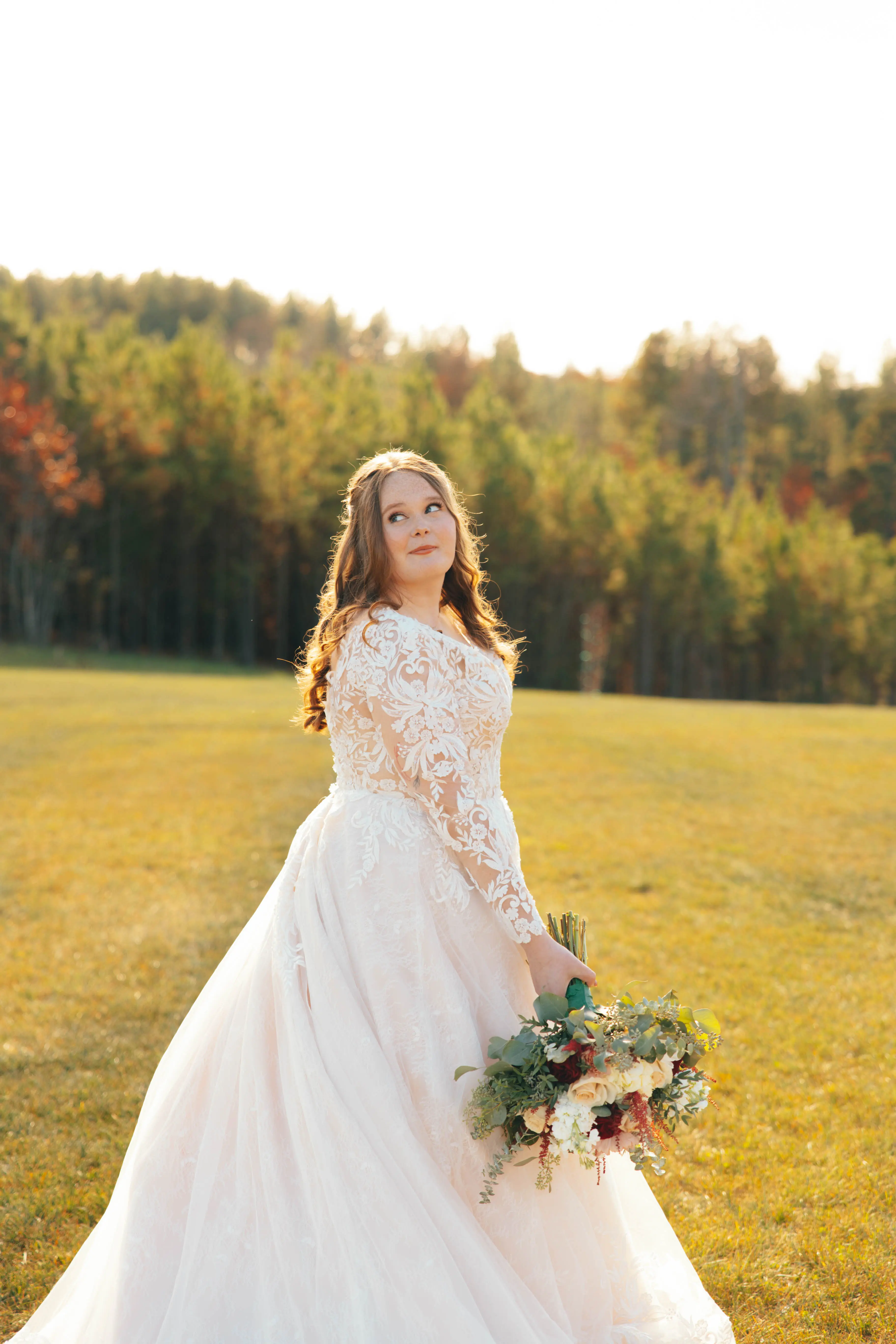 Bride wearing Zander wedding gown by Sottero and Midgley