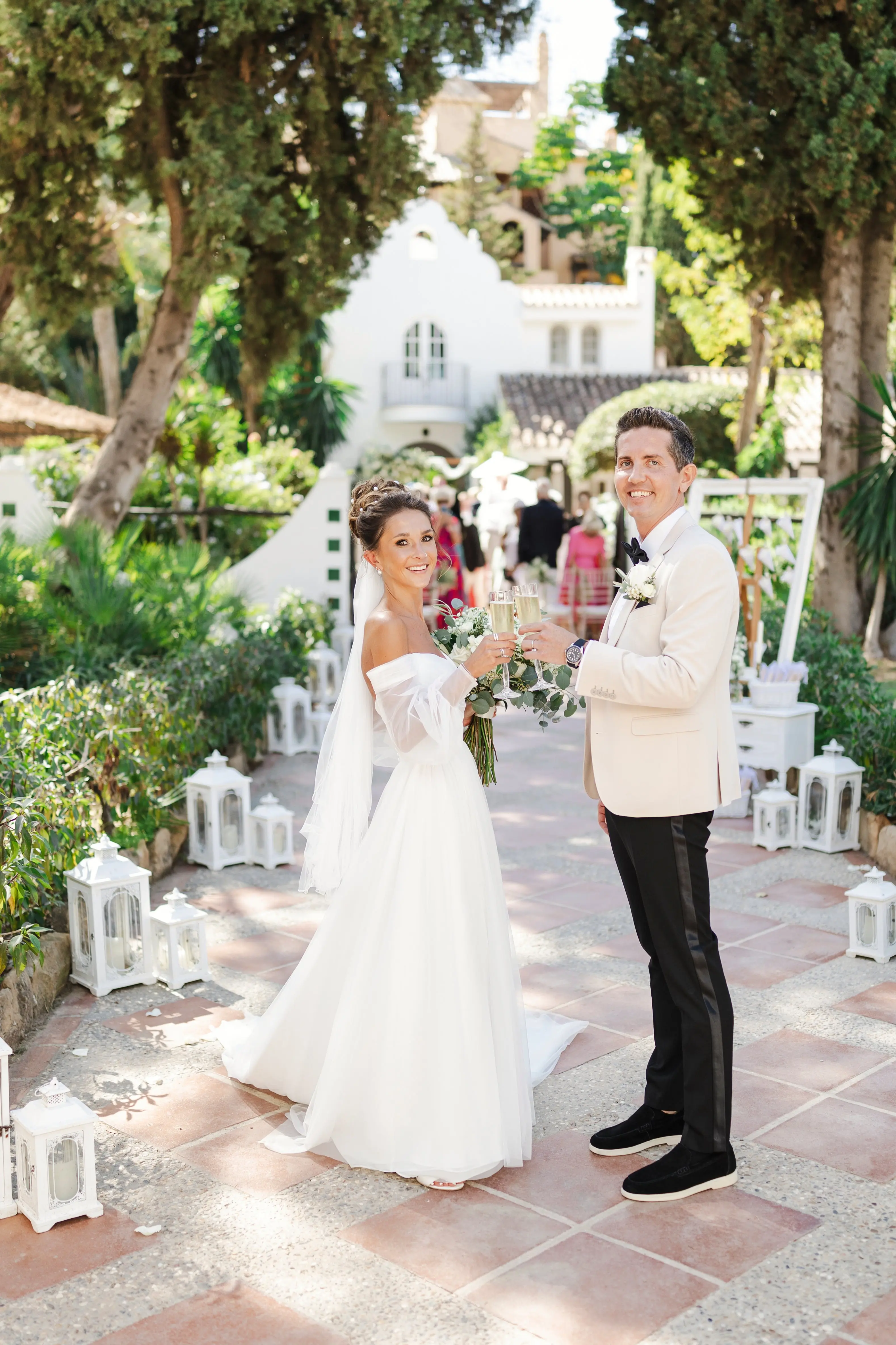 Bride Wearing Aline Wedding Dress Called Nerida By Sottero And Midgley Toasting Champagne With Groom