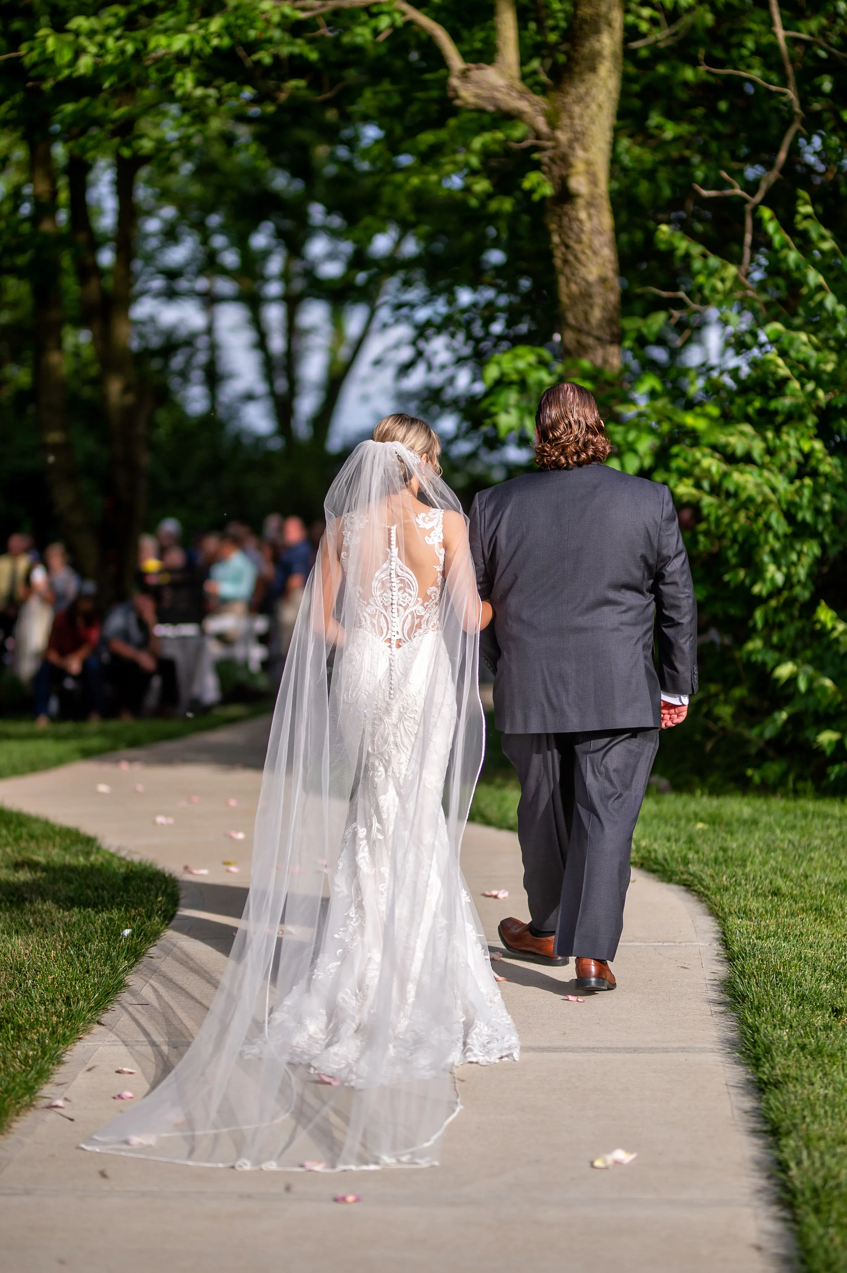 Bride in Elegant Lace Sheath Wedding Dress with Beaded Lace Motifs over Textured Tulle Called Hamilton by Sottero & Midgley