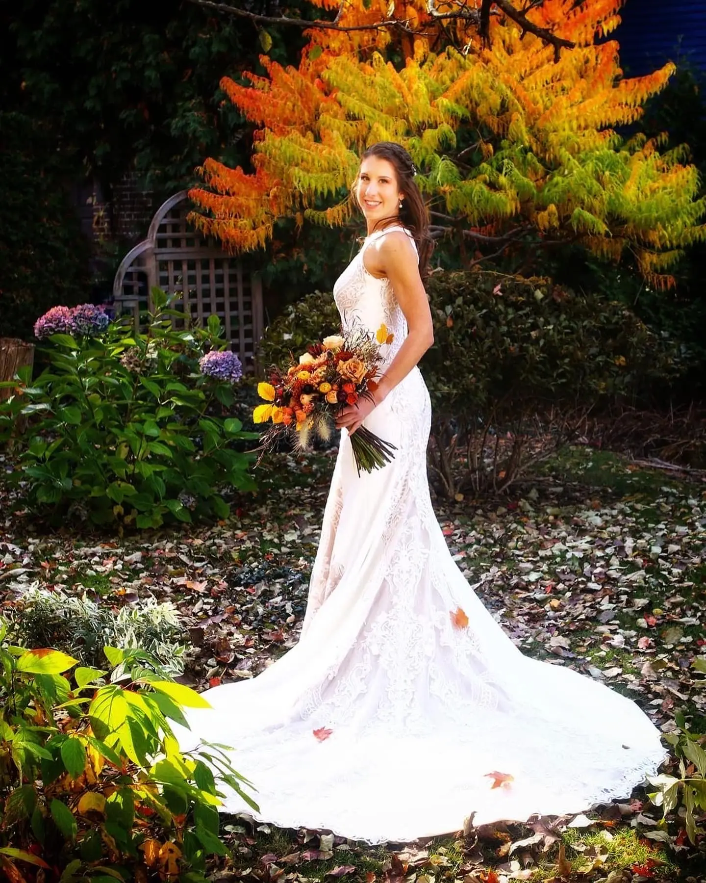Real Bride in Halter Fit-and-Flare Crepe Wedding Dress with Layers of Sheer Lace and Lace Motifs Called Kevyn by Sottero & Midgley