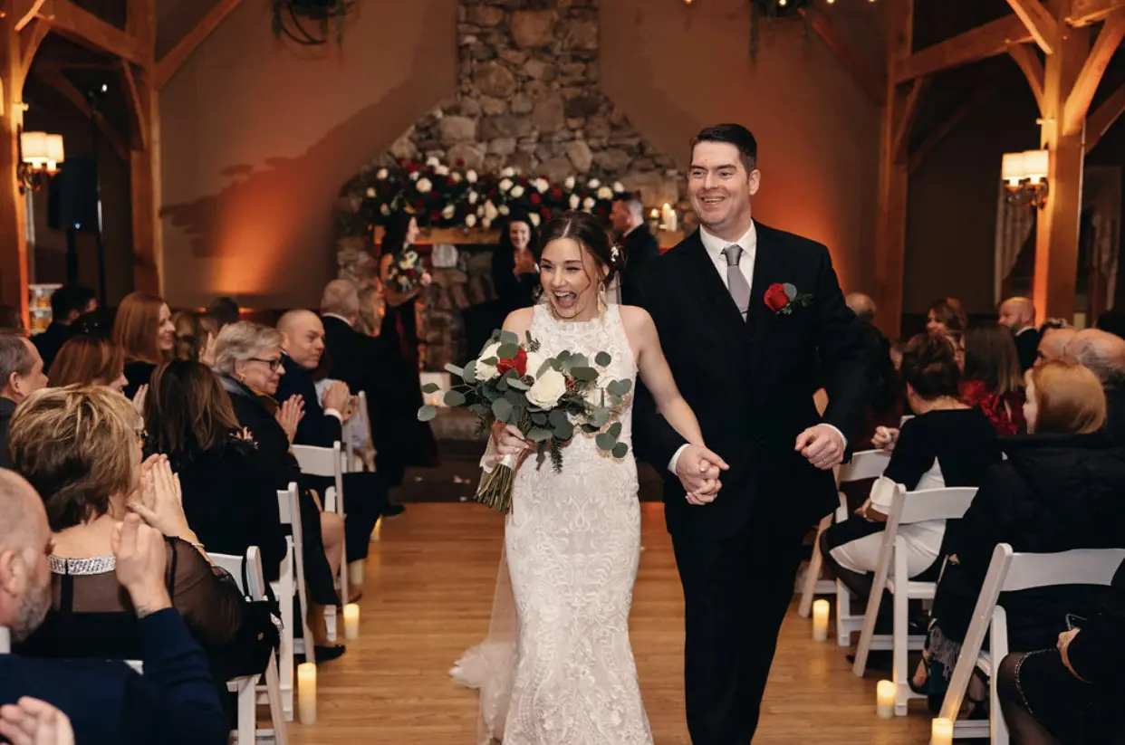Bride Wearing Lace Halter Wedding Gown Called Kevyn By Sottero And Midgley Walking With Her Husband