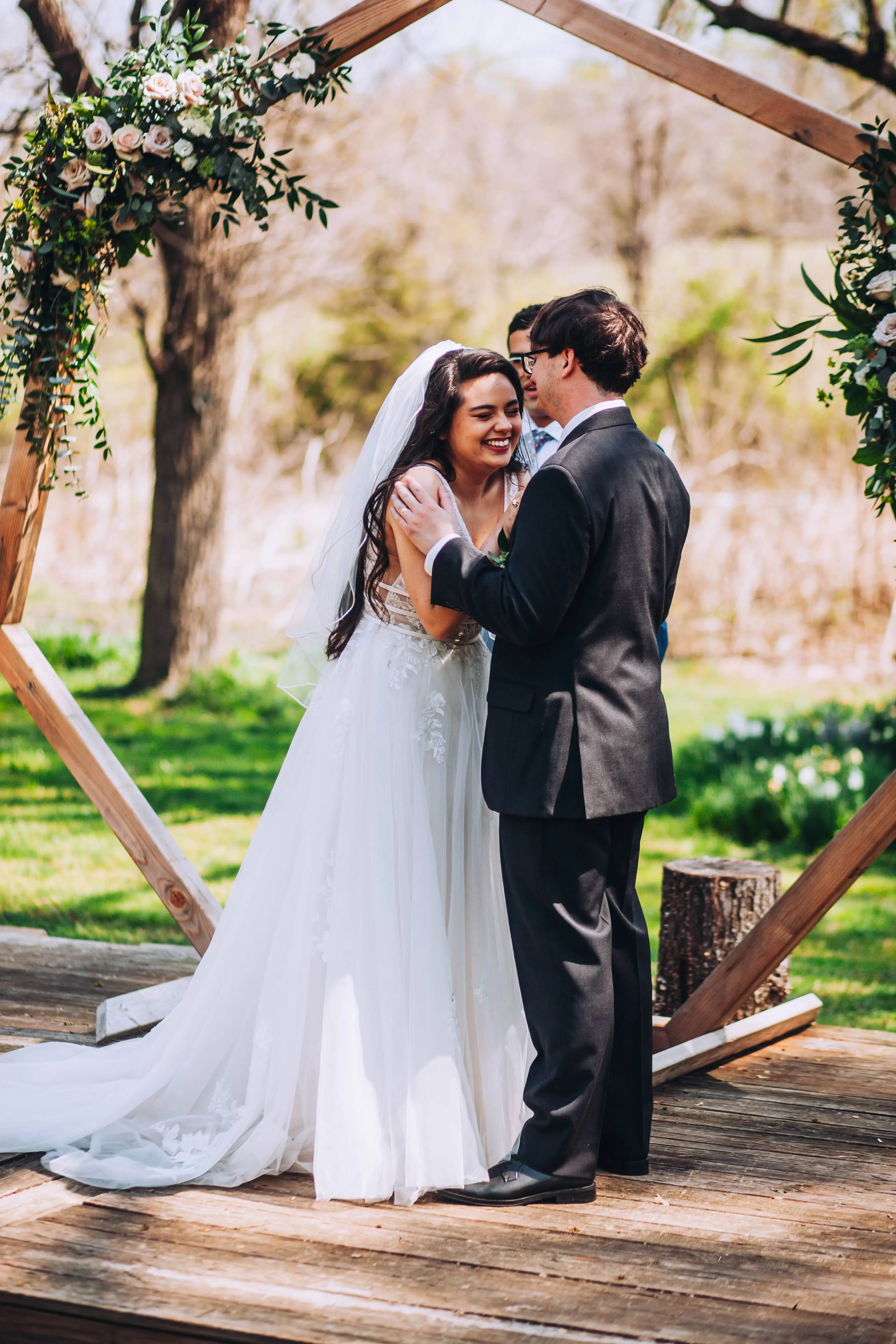 Groom With Bride Wearing Lace A-Line Wedding Dress Raelynn By Rebecca Ingram