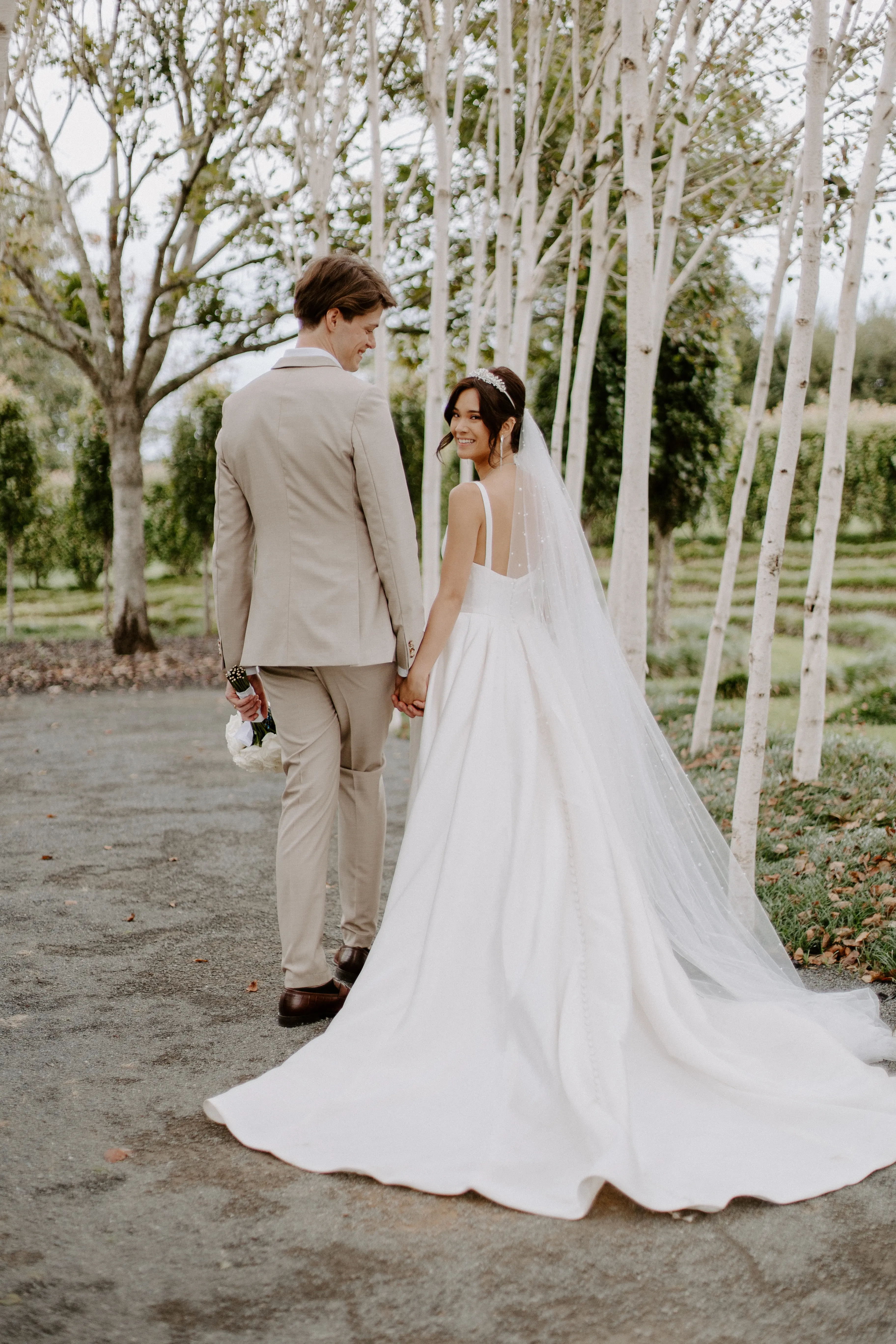 Bride In Satin A-Line Wedding Dress Called Selena By Maggie Sottero With Groom