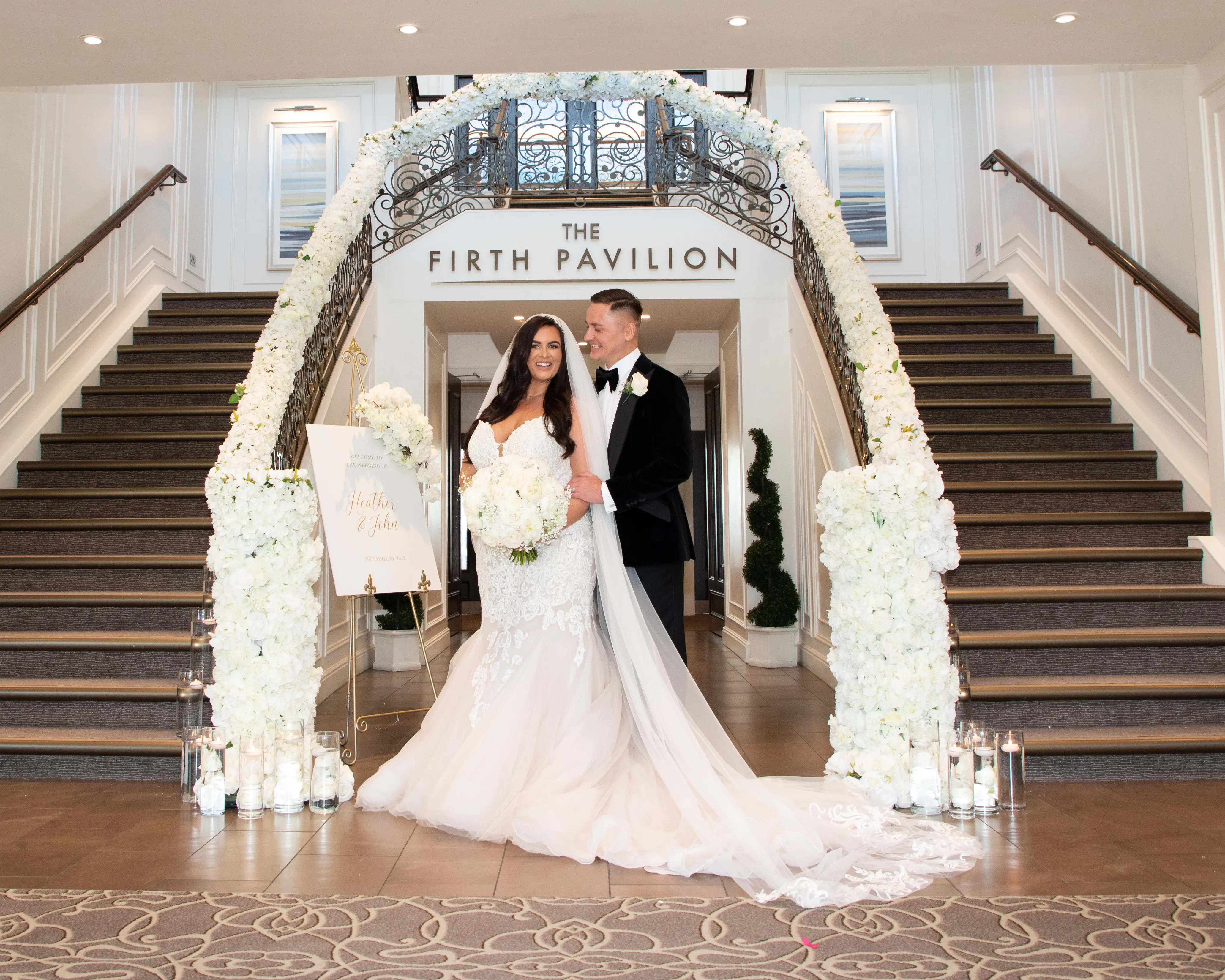 Bride in fit-and-flare wedding dress called Alistaire by Maggie Sottero with groom